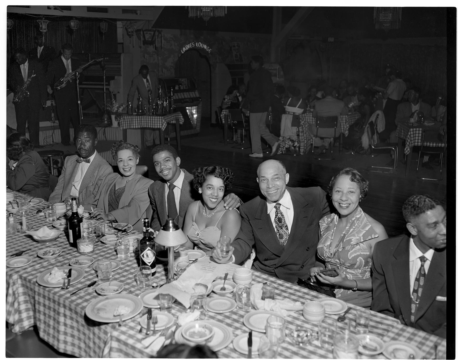 Image of Group around table at club party, Seattle, circa 1953
