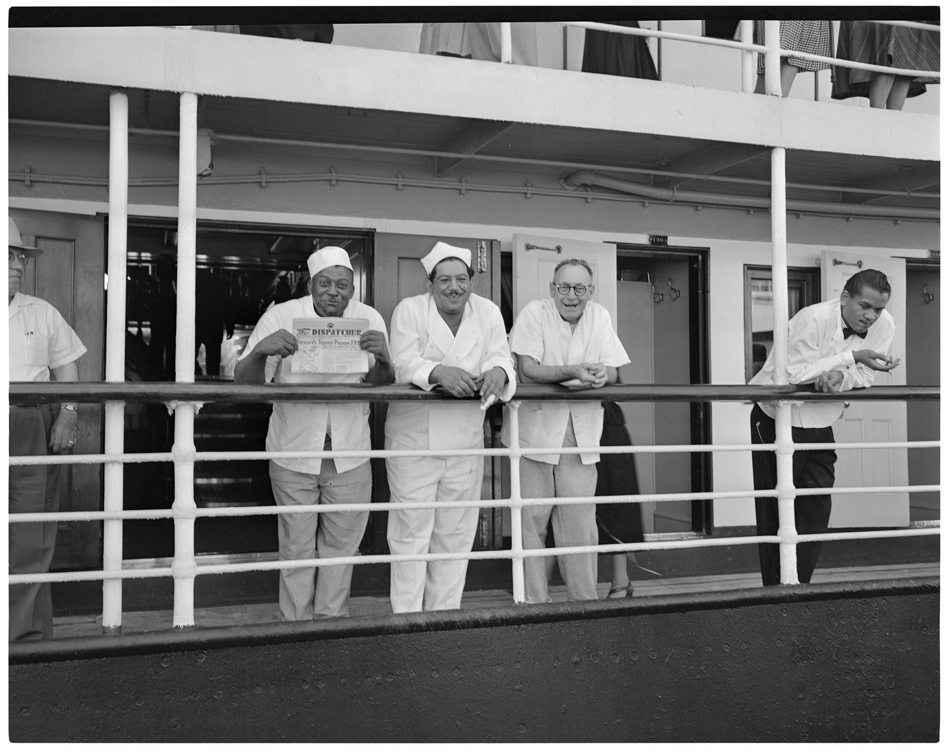 Image of Men standing at the rail of a ship, Seattle, circa 1953