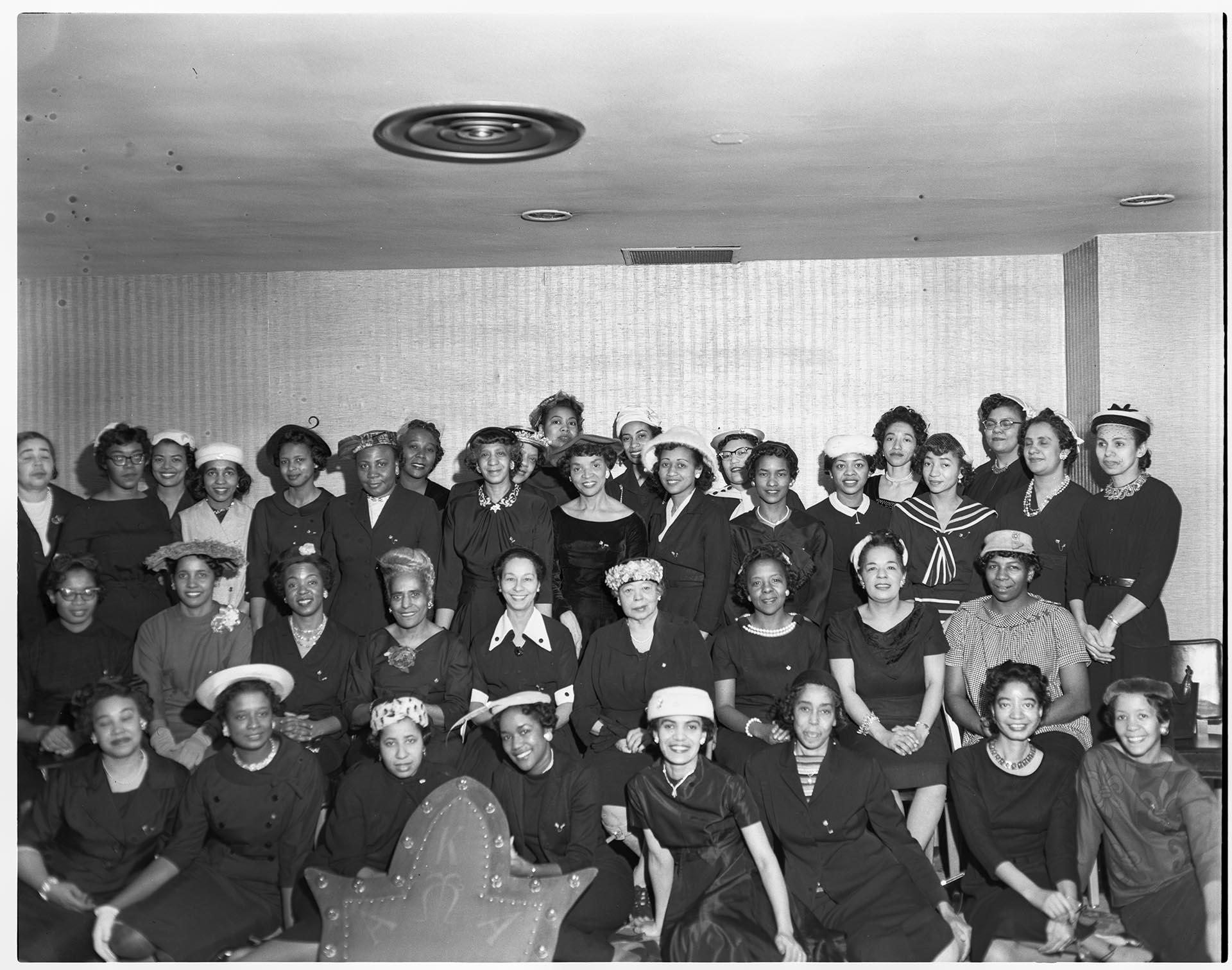 Image of Alpha Kappa Alpha sorority sisters posing with crest, Seattle, circa 1962
