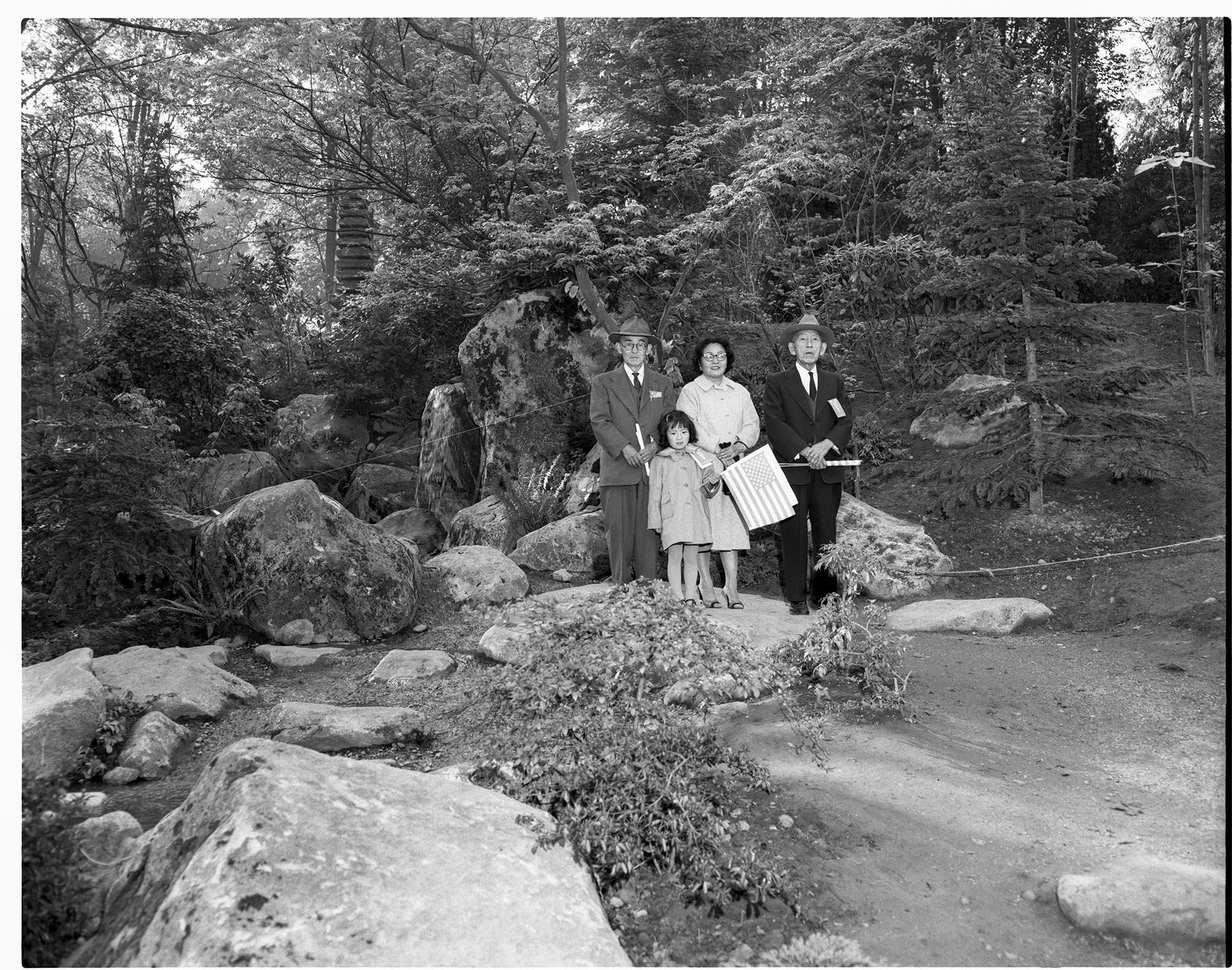 Image of Nakamura family posing in garden, Seattle, circa 1962