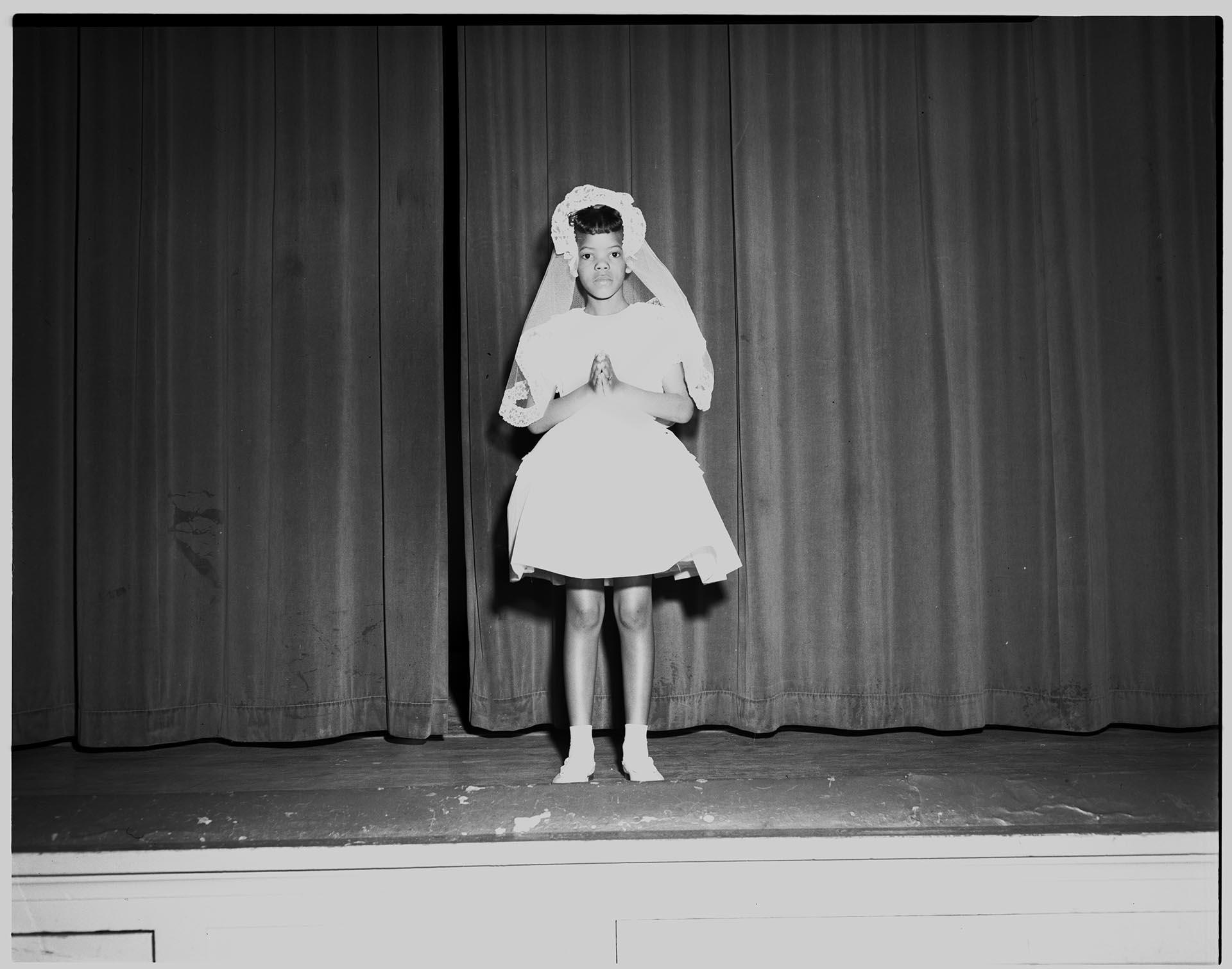 Image of Girl posing on stage after First Communion, Seattle, circa 1953