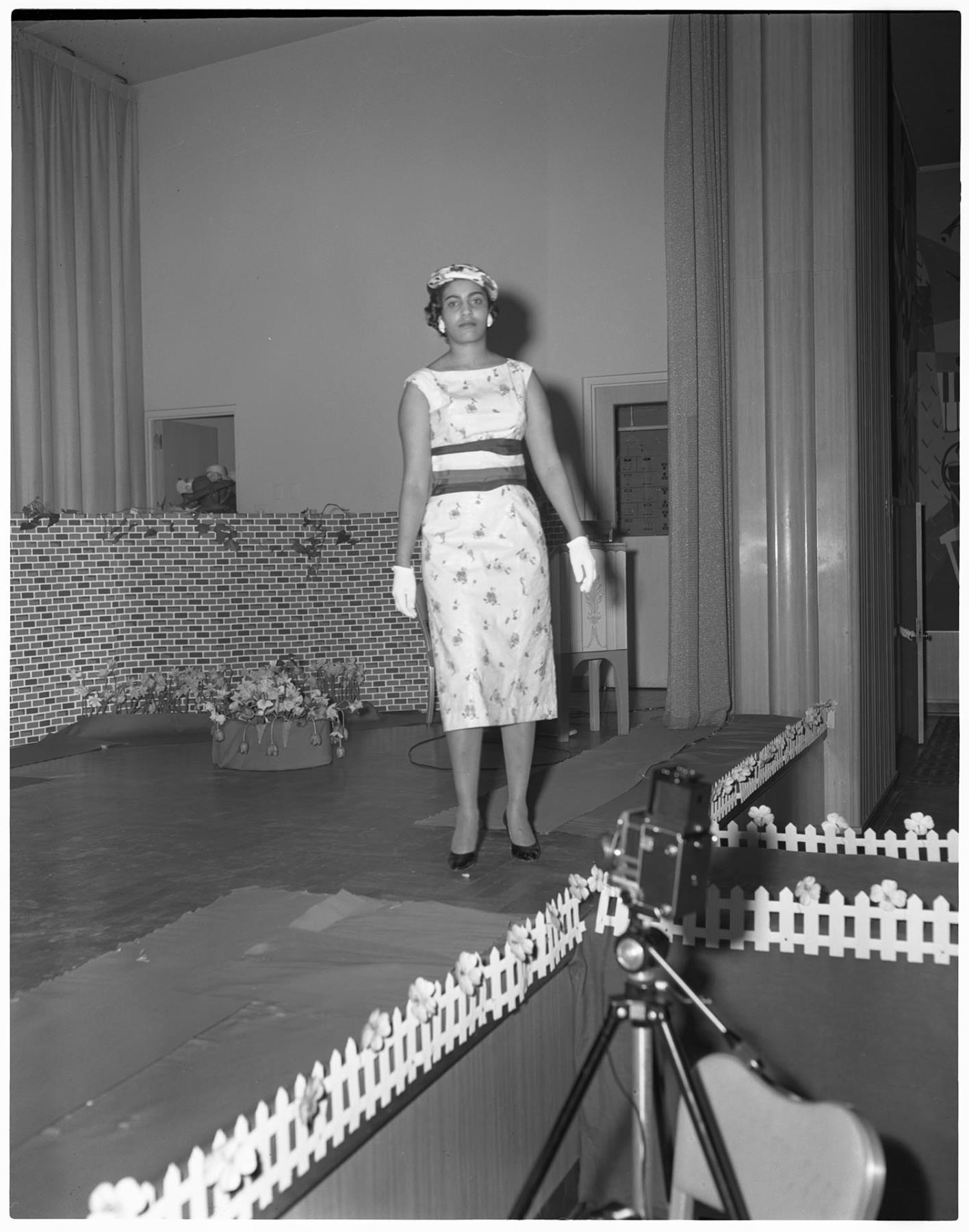 Image of Woman modeling dress on stage, Seattle, circa 1953