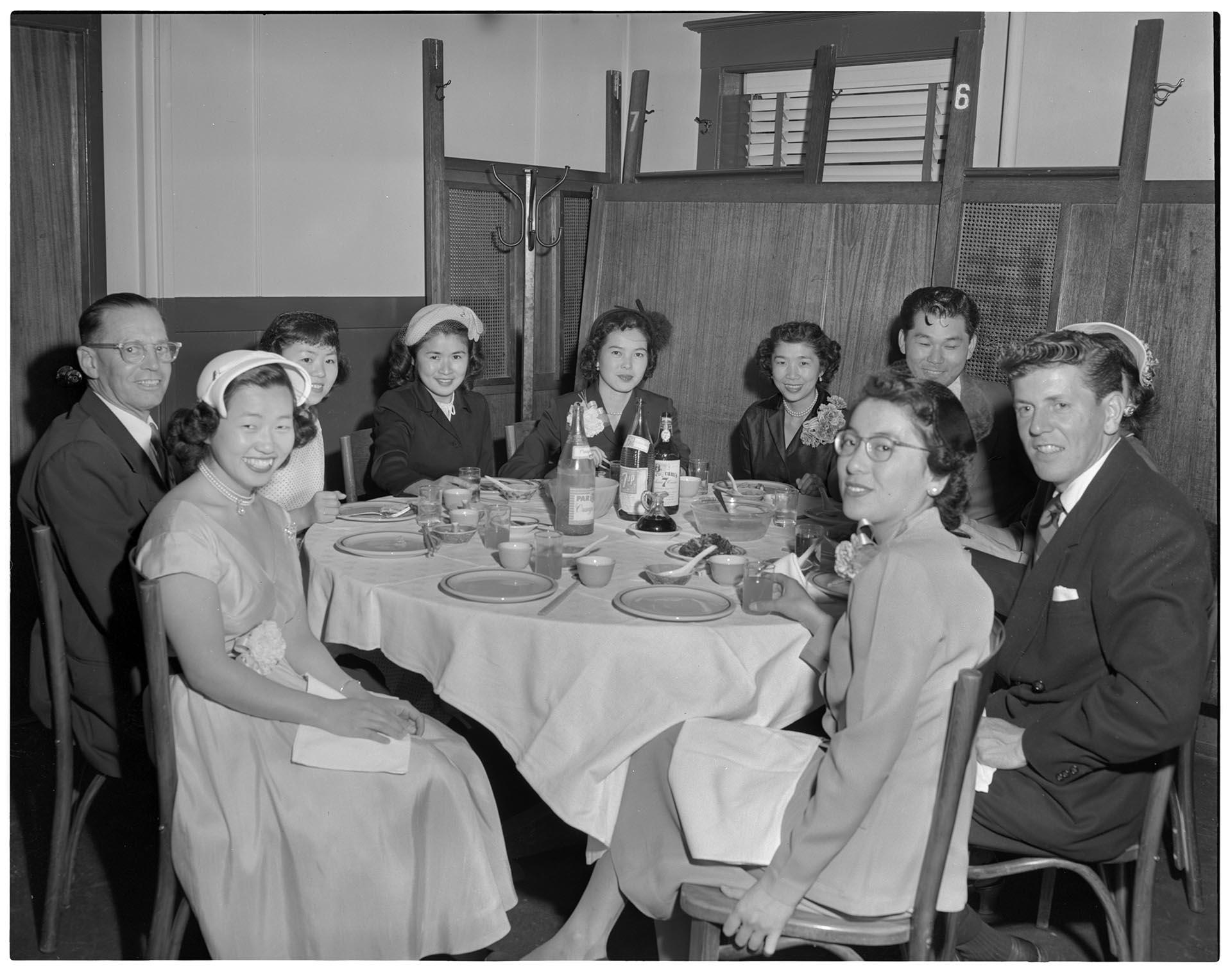 Image of Guests posing at wedding reception, Seattle, circa 1953