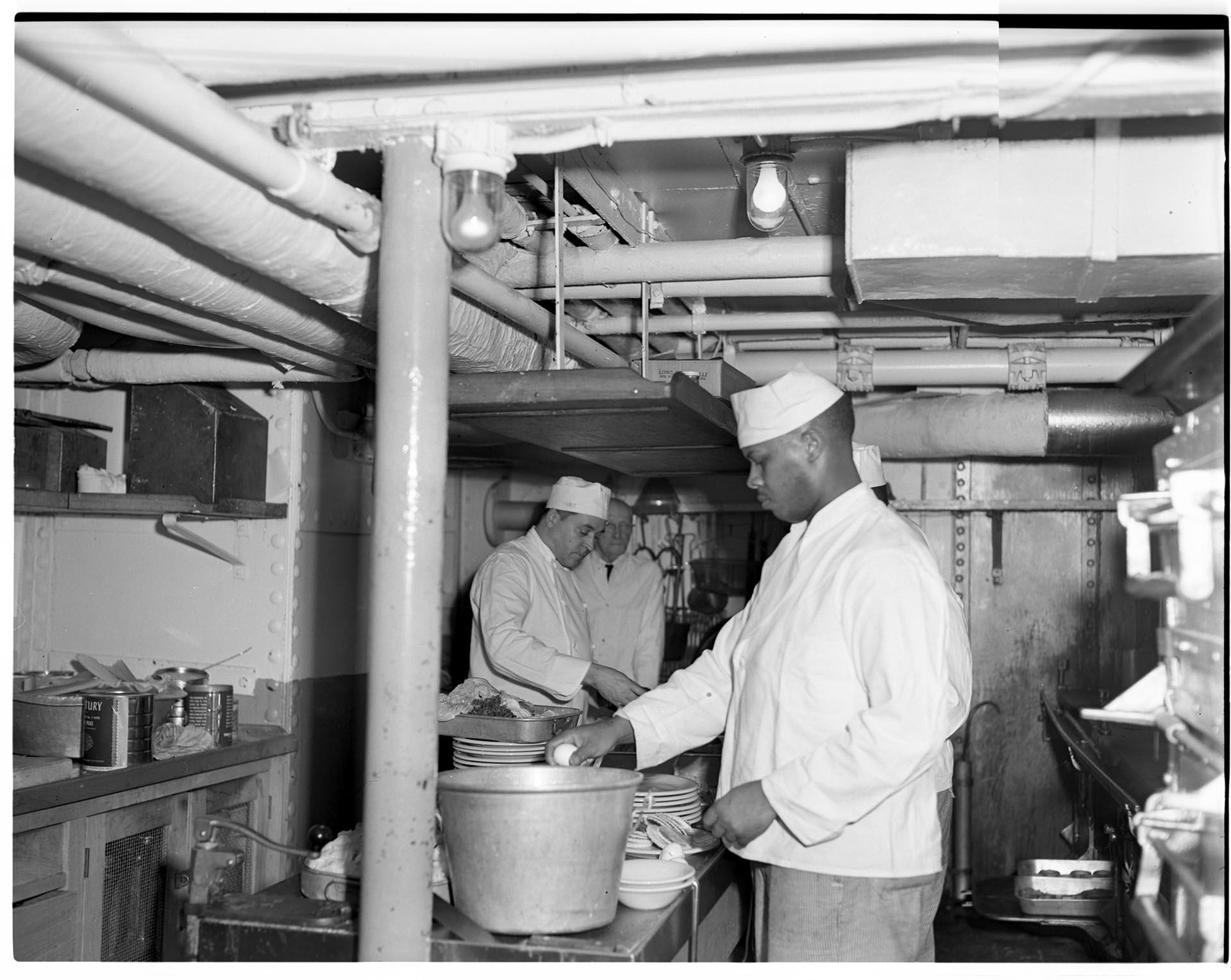 Image of Crew members working in the galley of a ship, Seattle, circa 1953