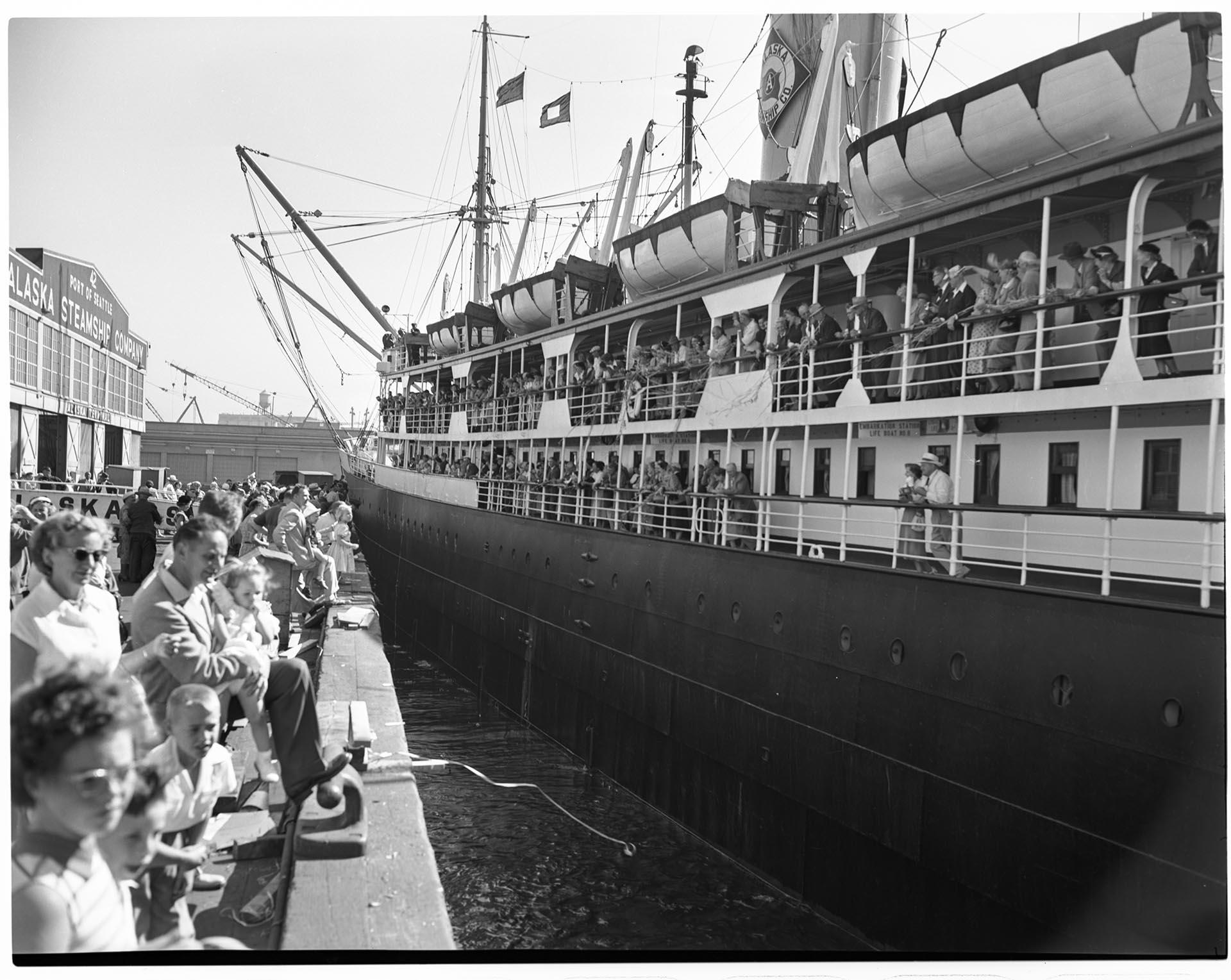 Image of Ship pulling away from pier, Seattle, circa 1953