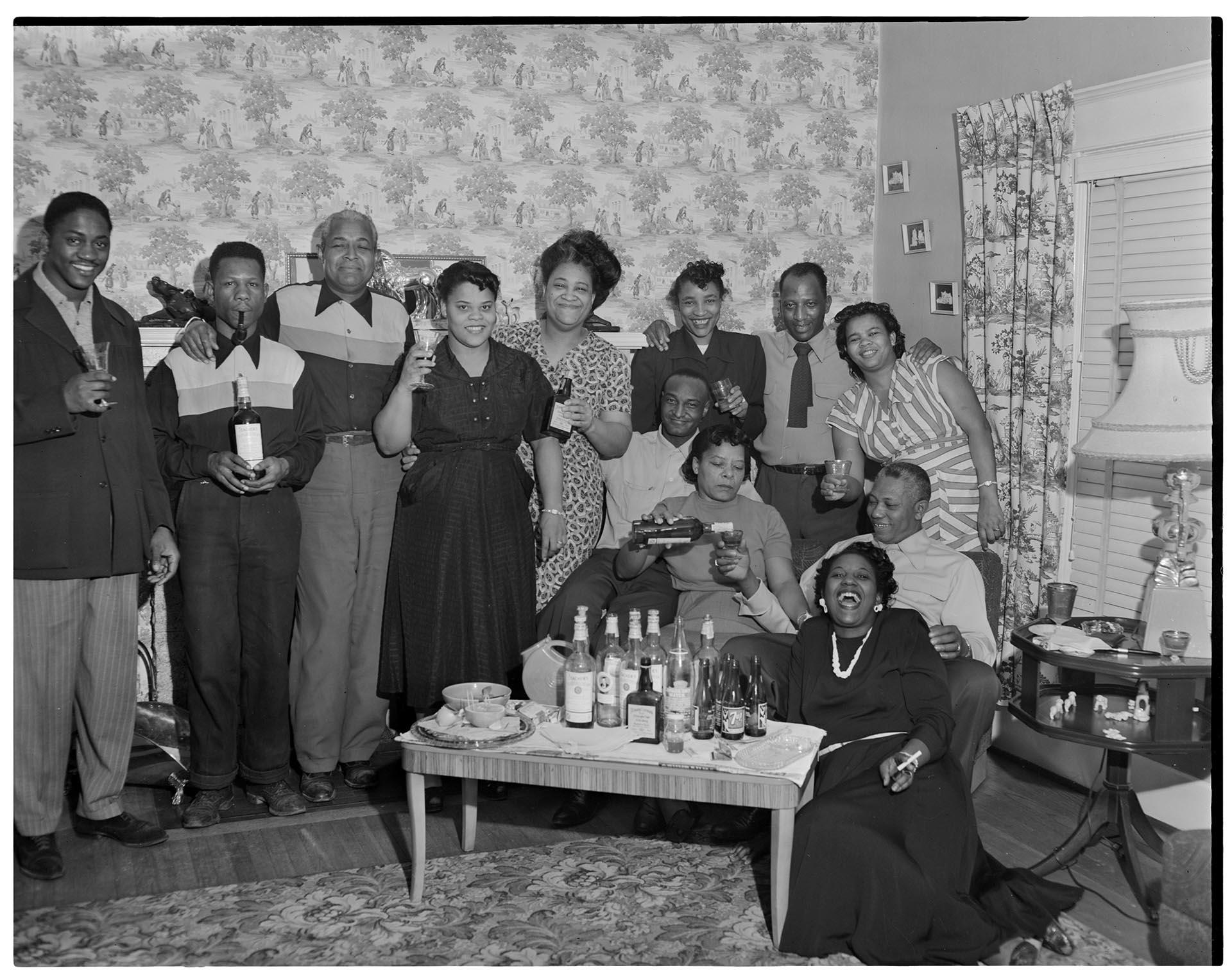 Image of Party group posing with raised glasses, Seattle, circa 1953