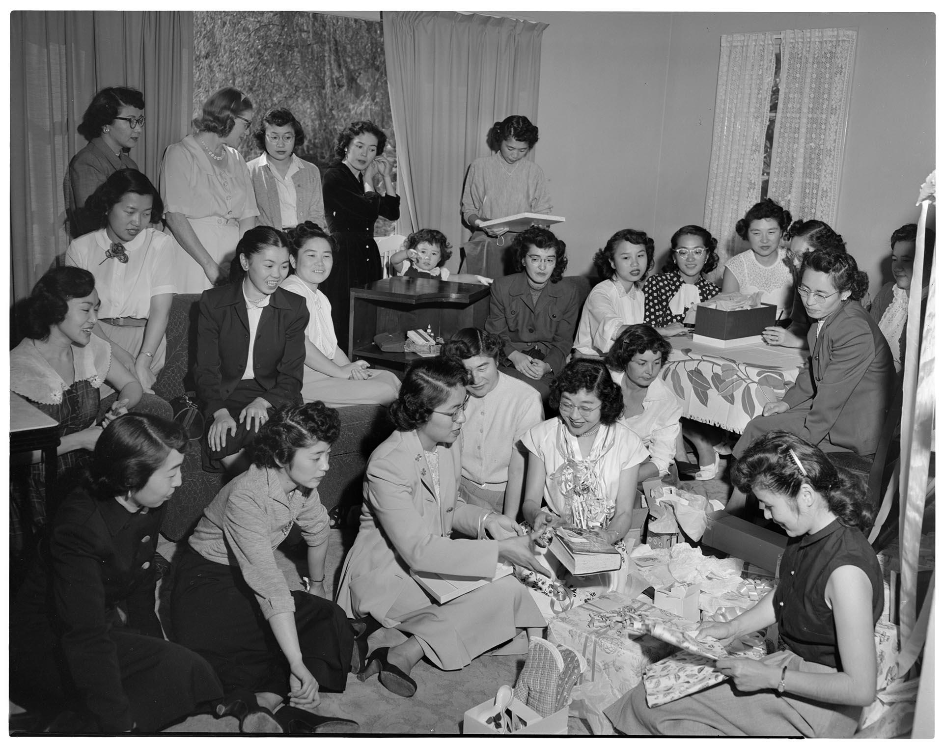 Image of Miss Kimura opening gifts at wedding shower, Seattle, circa 1953