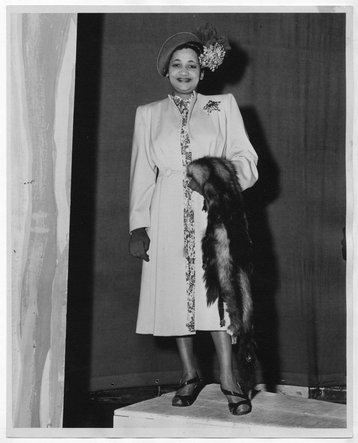 Image of Woman modeling outerwear at fashion show, circa 1955