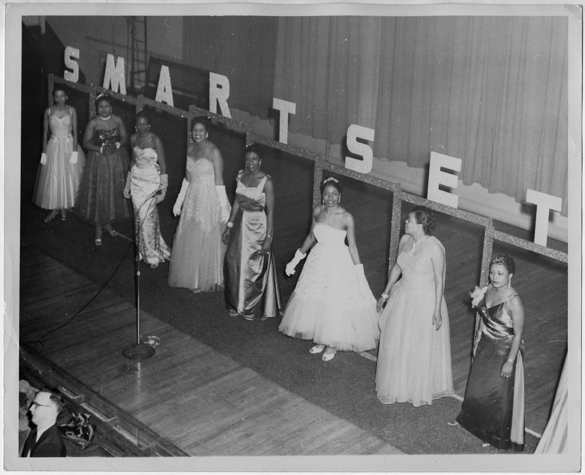 Image of Woman modeling dress at fashion show, circa 1955