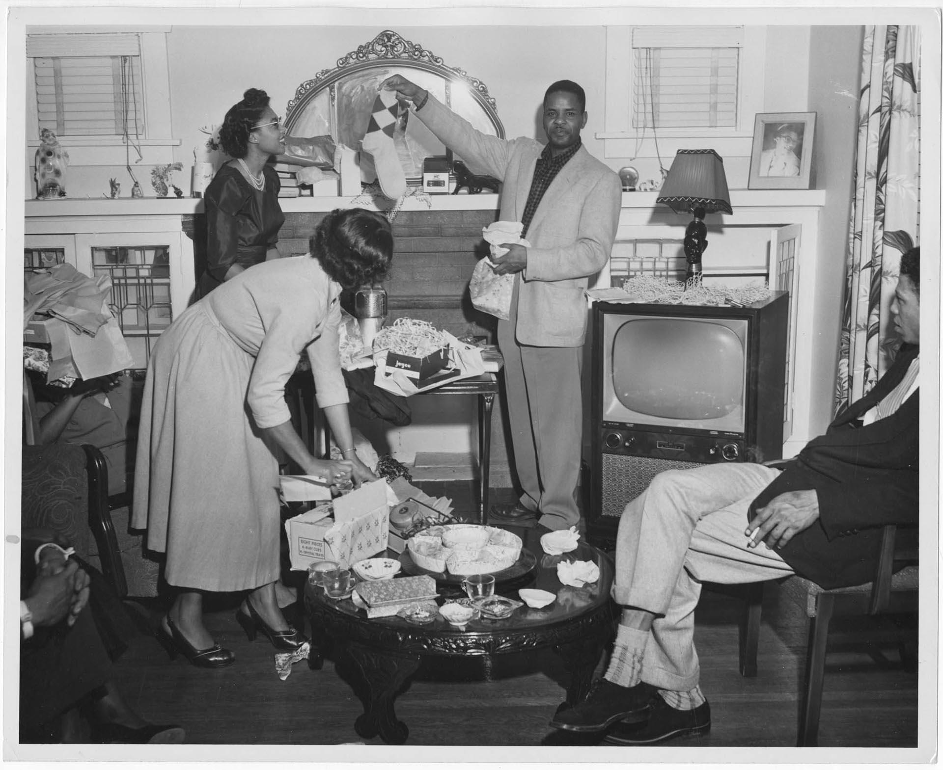 Image of People at home opening gifts, Seattle, circa 1955