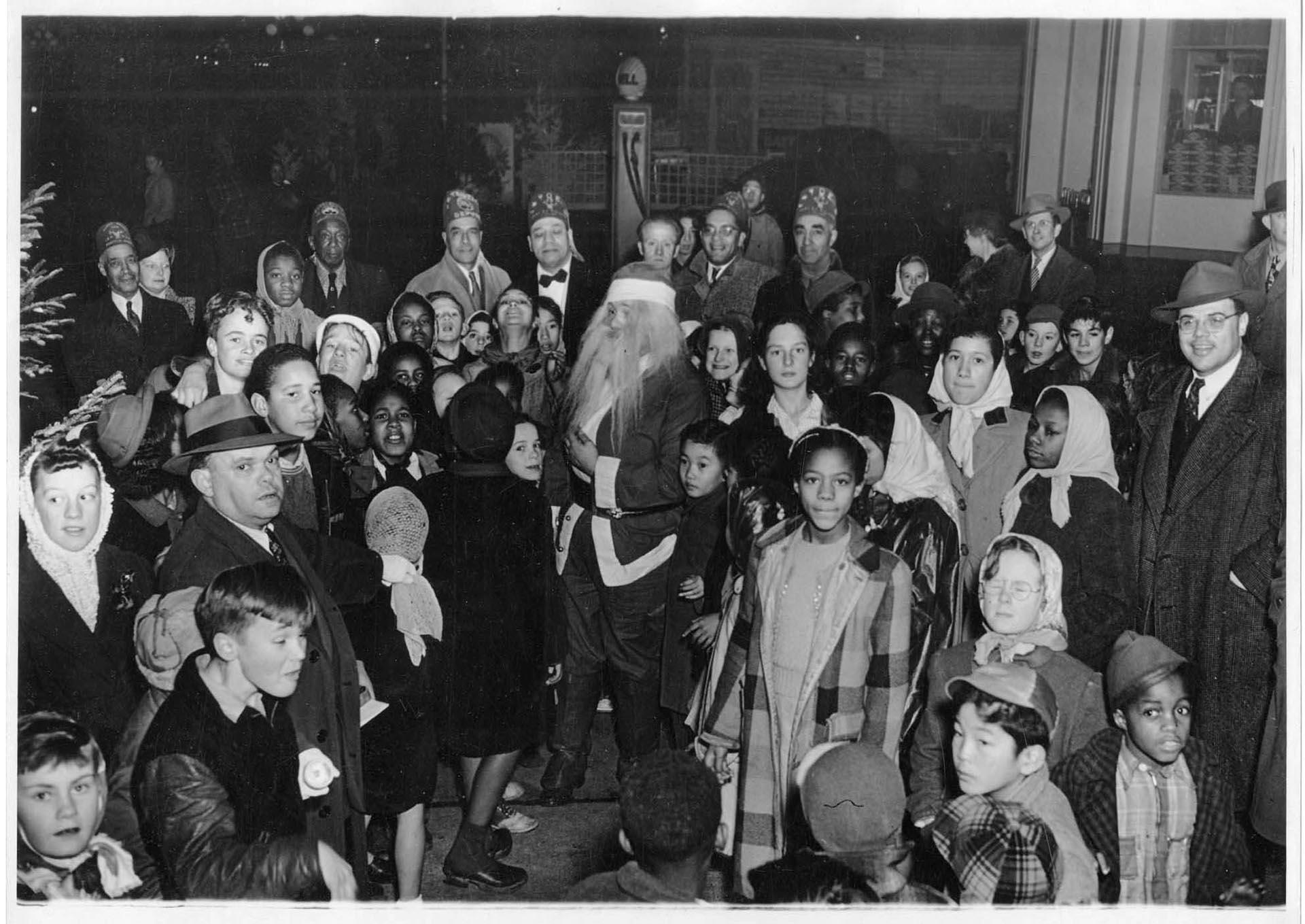 Image of Santa Claus and group of children, circa 1954