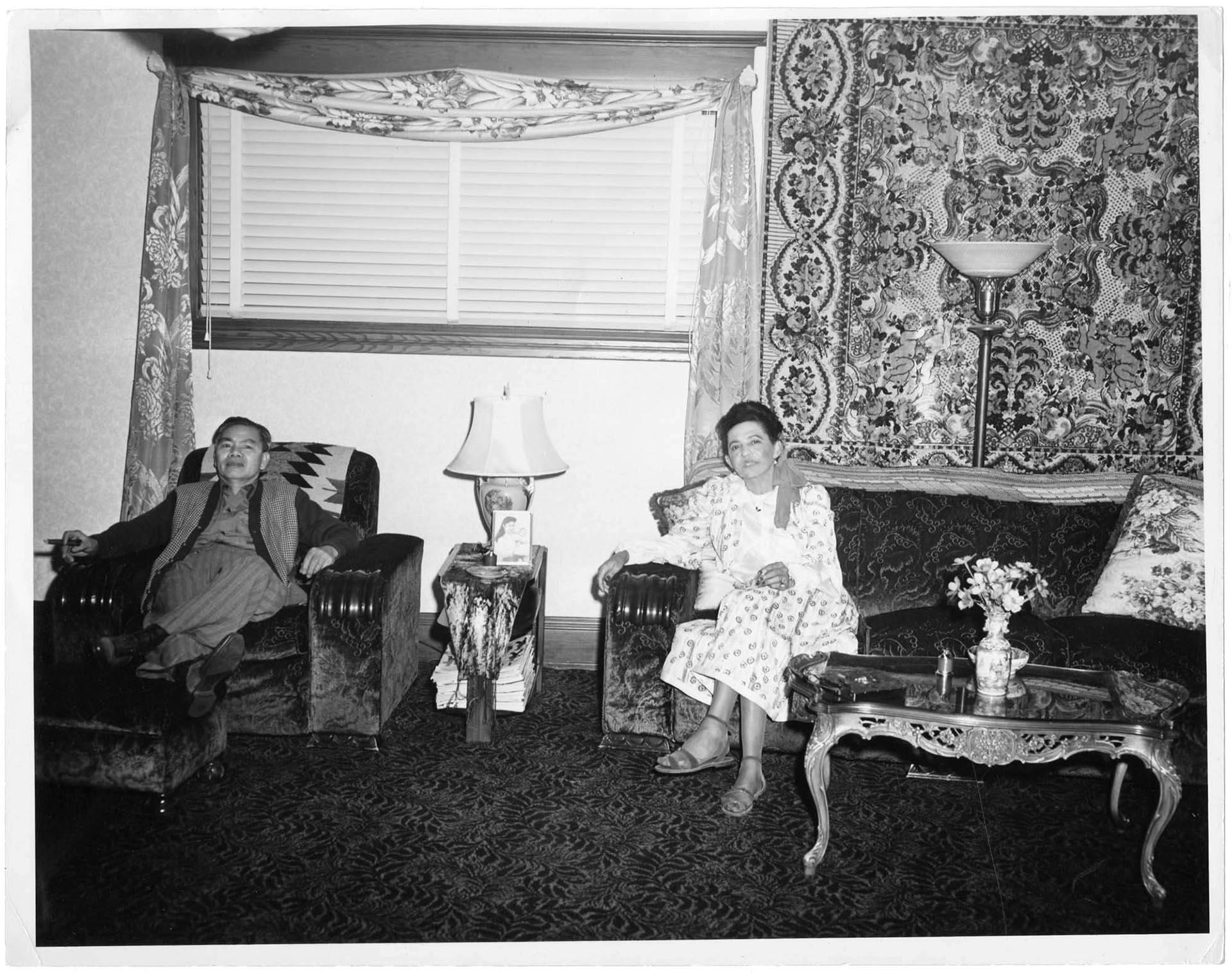 Image of Couple seated in a living room, circa 1954