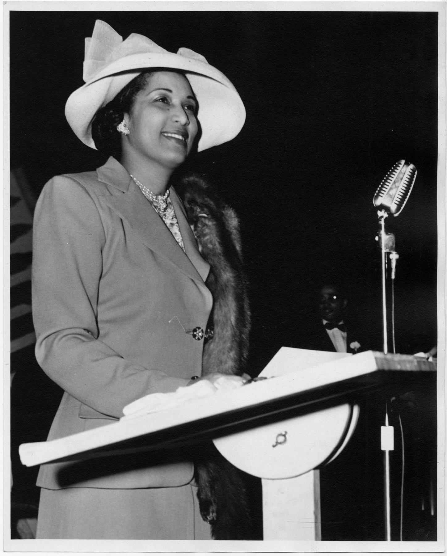 Image of Ola Browning speaking at fashion show, Seattle, circa 1953
