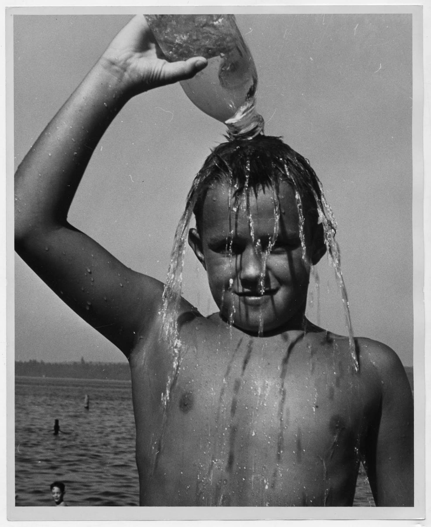 Image of Boy pouring water over his head, Seattle, circa 1953