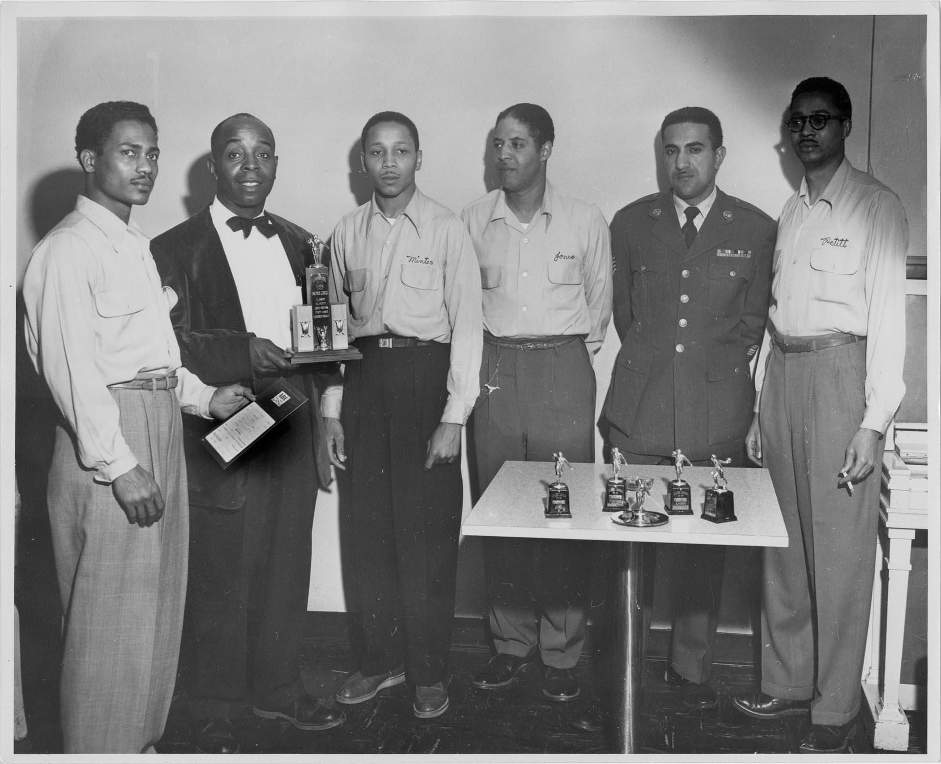 Image of Members of a bowling team with trophies, Seattle, circa 1956