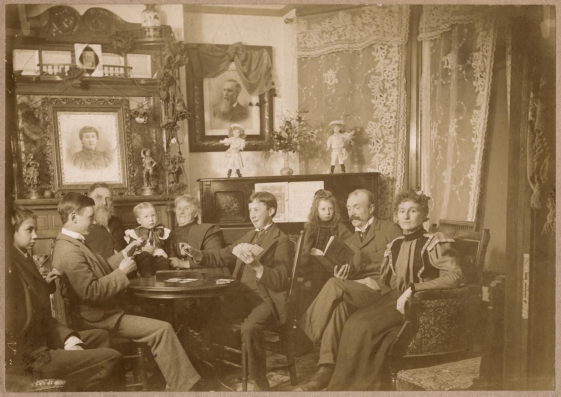 Image of Horton family posing together in parlor, Seattle, circa 1898