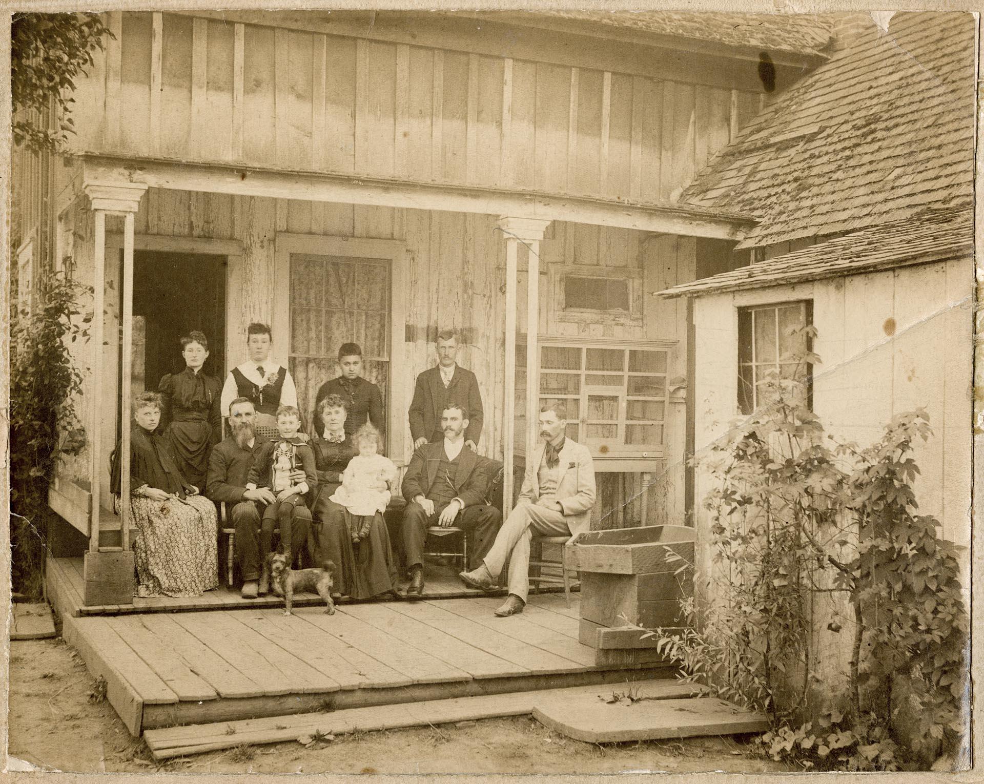 Image of Horton family posing together on porch, Seattle, circa 1890