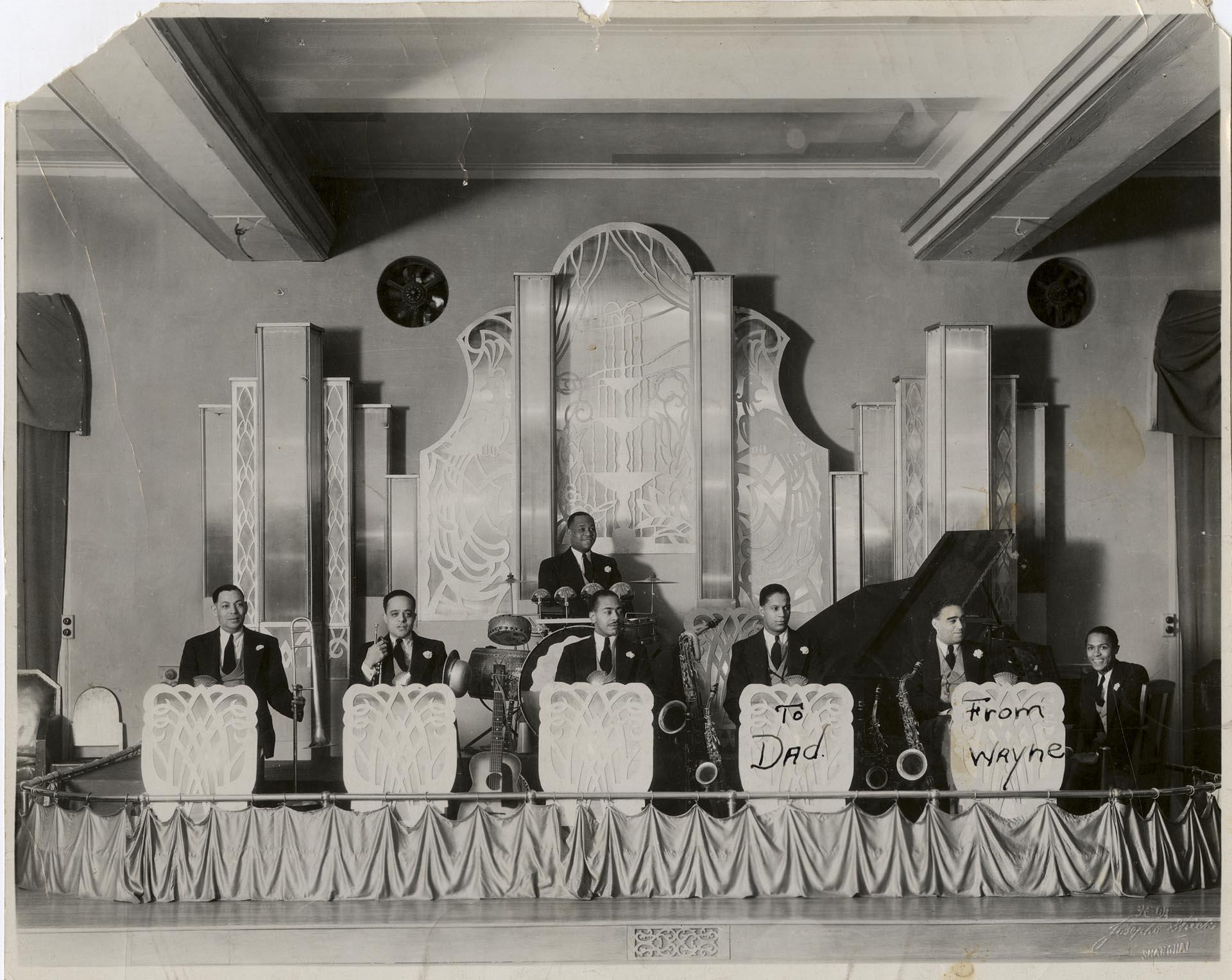 Image of Earl Whaley's band on stage in Shanghai, China, December 20, 1934