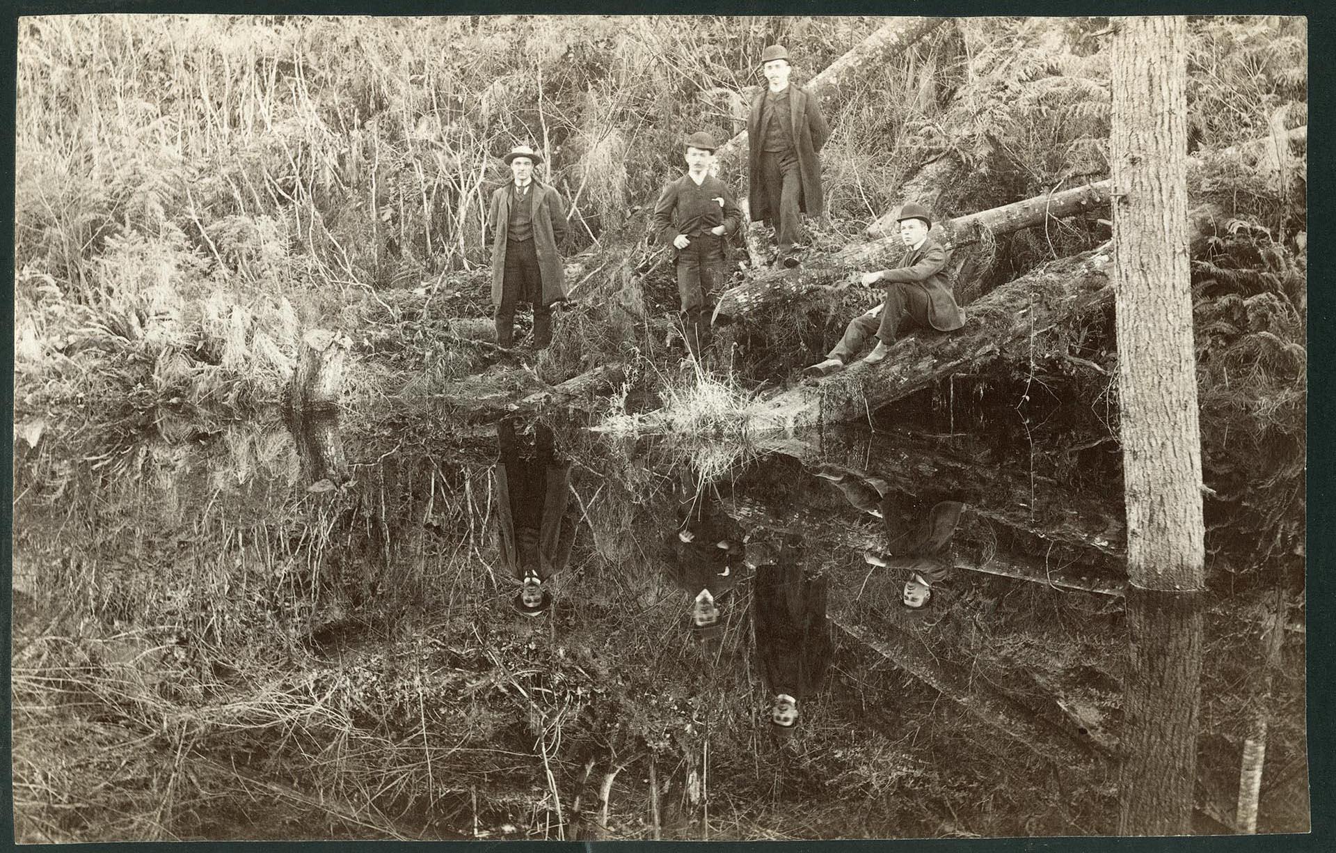 Image of Men posing in ravine at Ravenna Park, Seattle, circa 1900