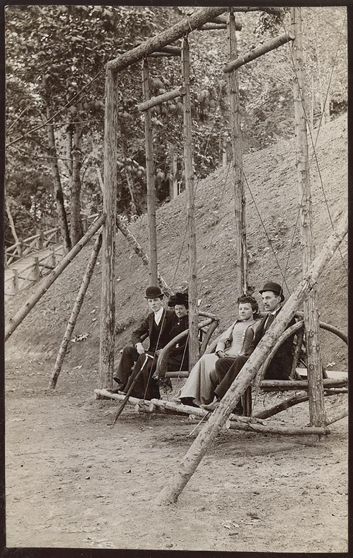 Image of Two couples on gliders at Madrona Park, Seattle, circa 1895