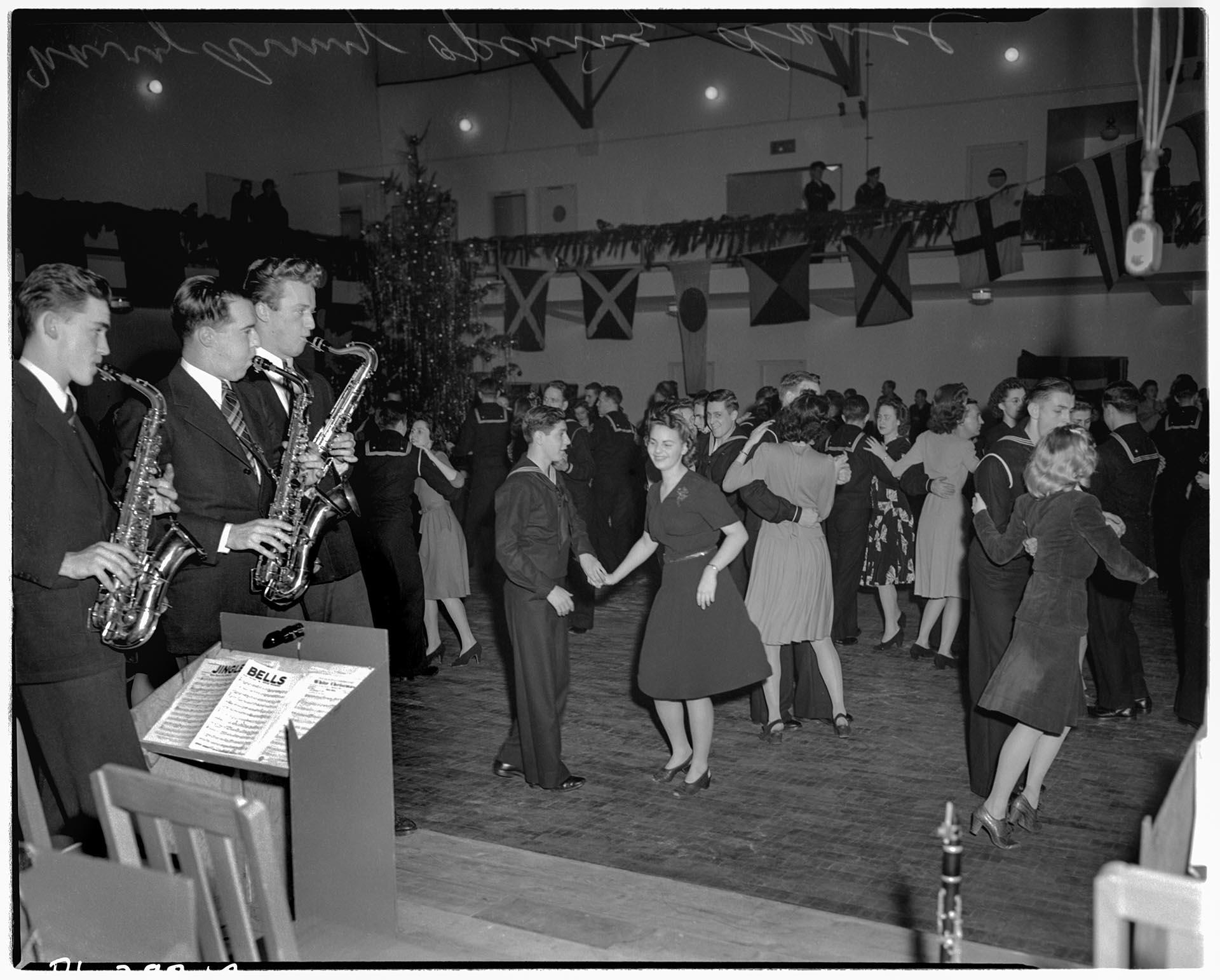 Image of Women and servicemen dancing at the Naval Reserve Armory, Seattle, December 1942