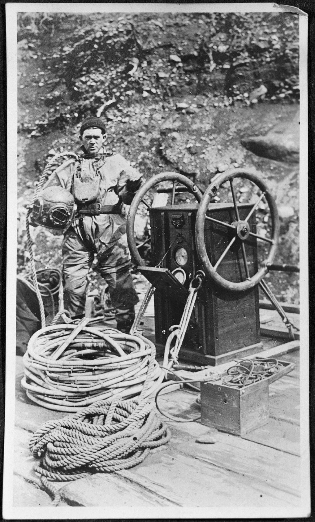Image of Henry Finch posing with diving equipment, Seattle, January 1924