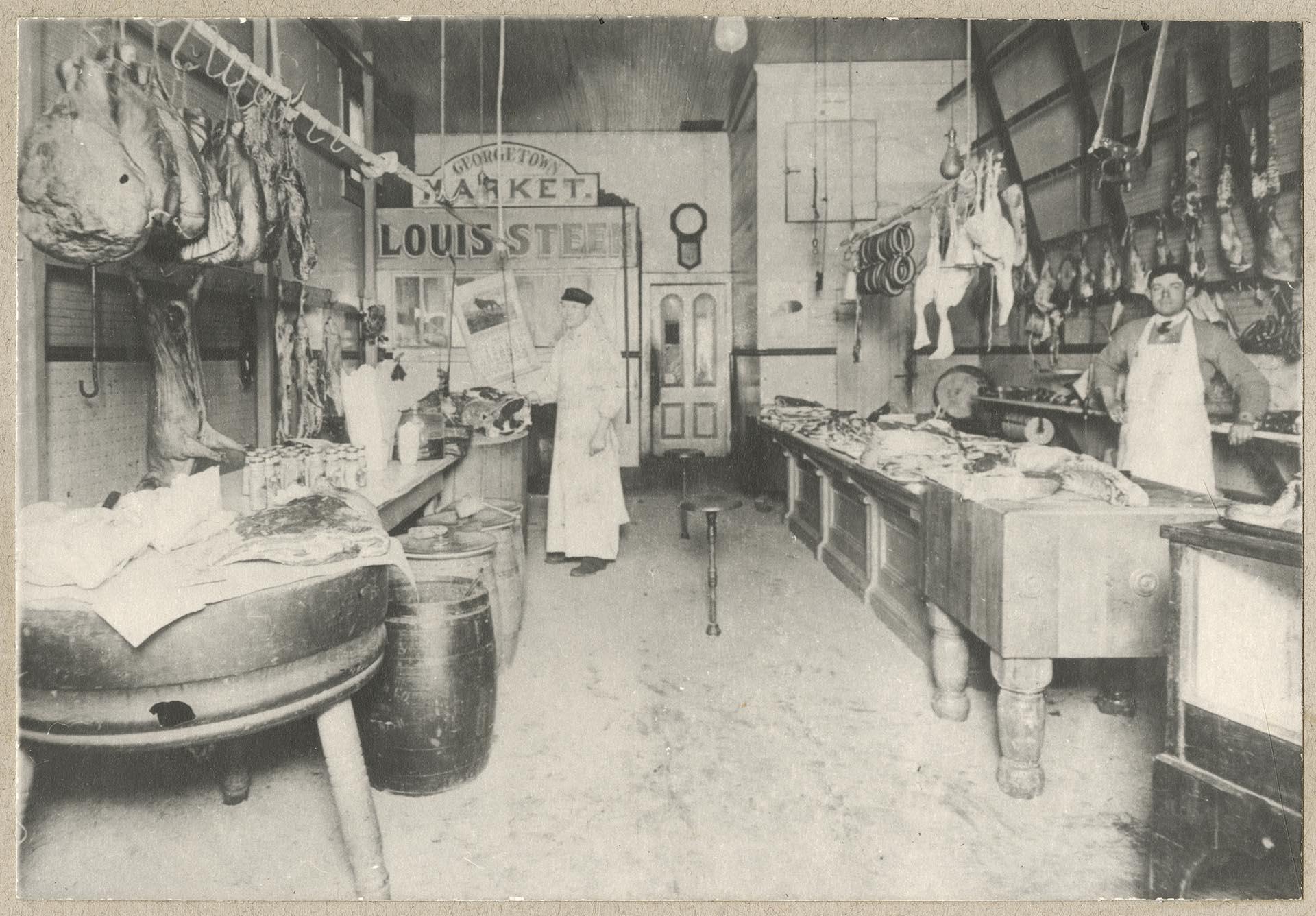 Image of William Myers and Frank Krauland in Georgetown Market, Seattle, 1911