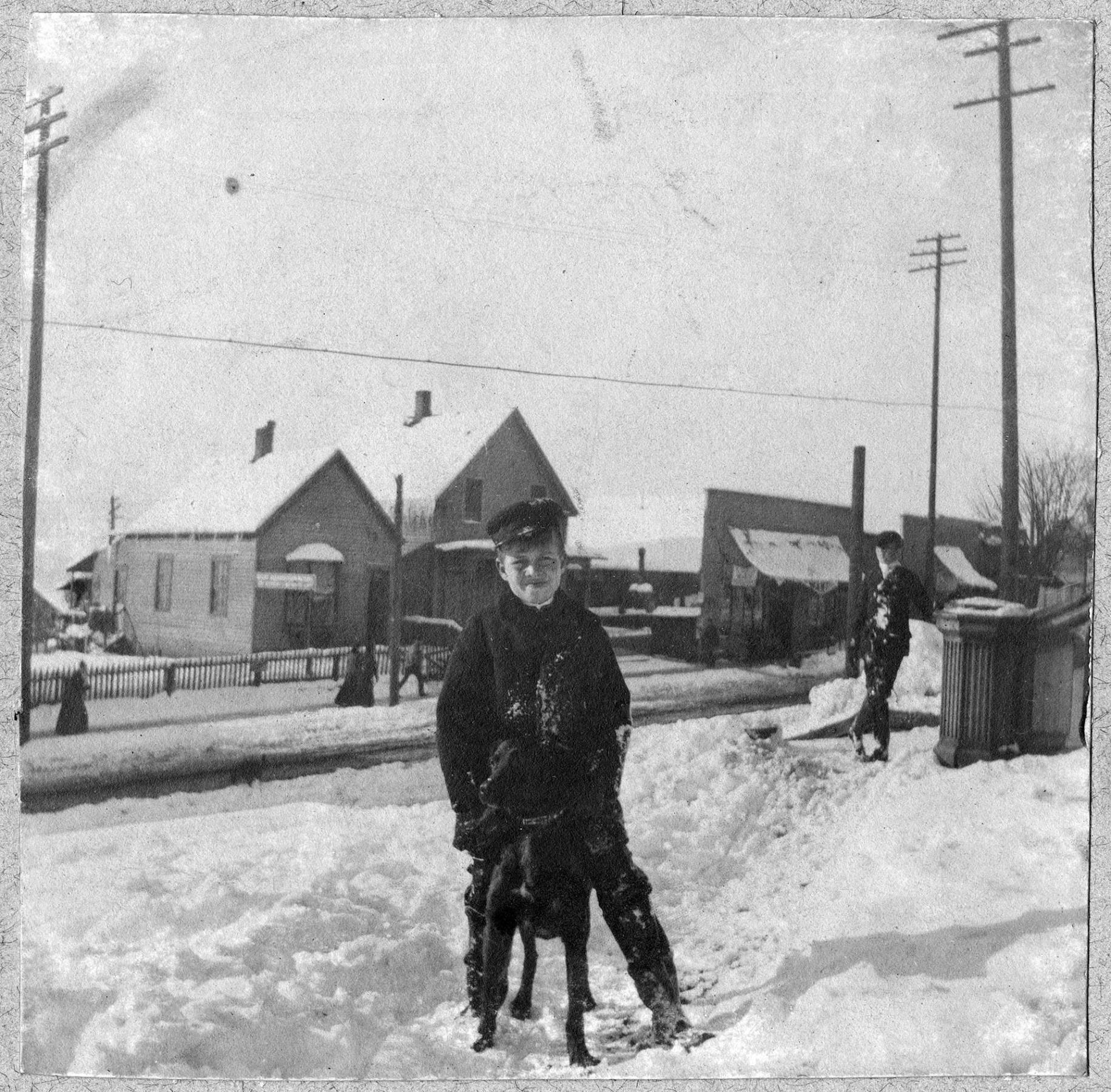 Image of Boy and dog in snow on 3rd Avenue, Seattle, 1897