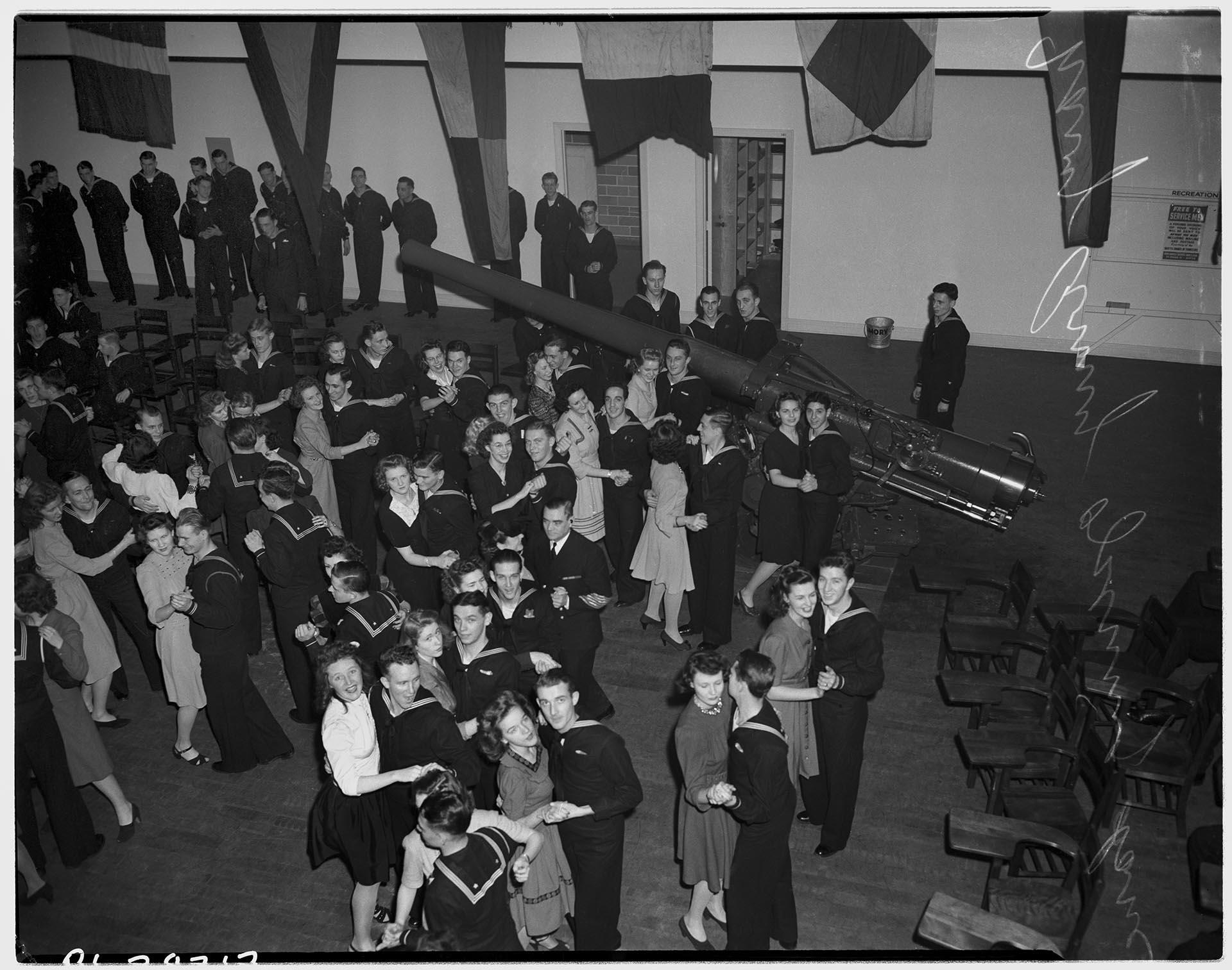 Image of Women and servicemen dancing at the Naval Reserve Armory, Seattle, December 1942