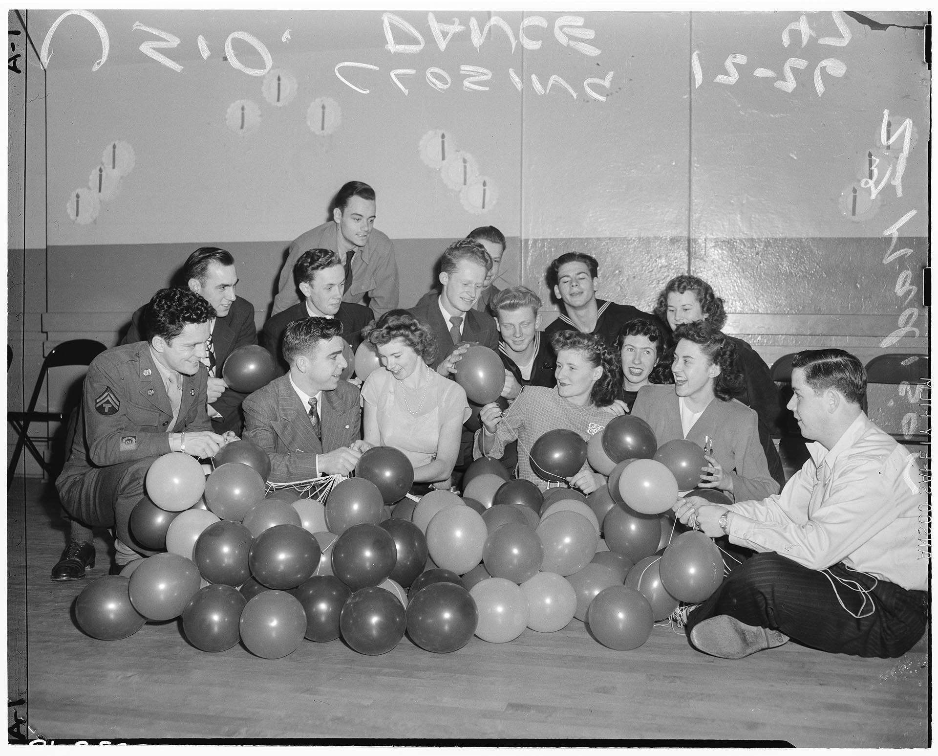 Image of Attendees decorating dance floor at USO, Seattle, December 26, 1947