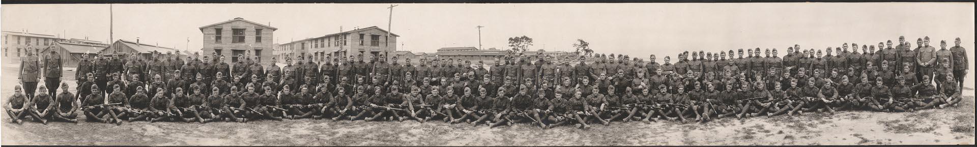 Image of Members of Co. C, 318th National Guard, posing in front of barracks, Vancouver, Washington, 1917