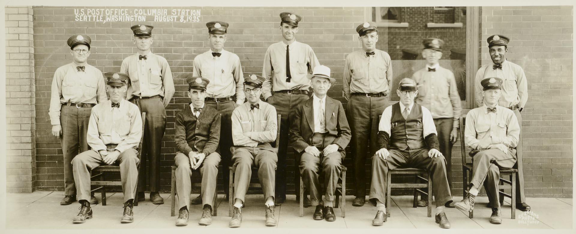 Image of U.S. Post office employees in front of Columbia Station, Seattle, August 8, 1935