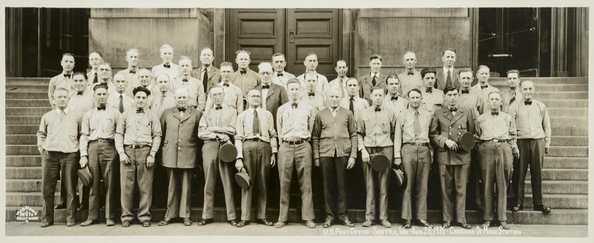 Image of U.S. Post office employees in front of Main Station, Seattle, August 28, 1935