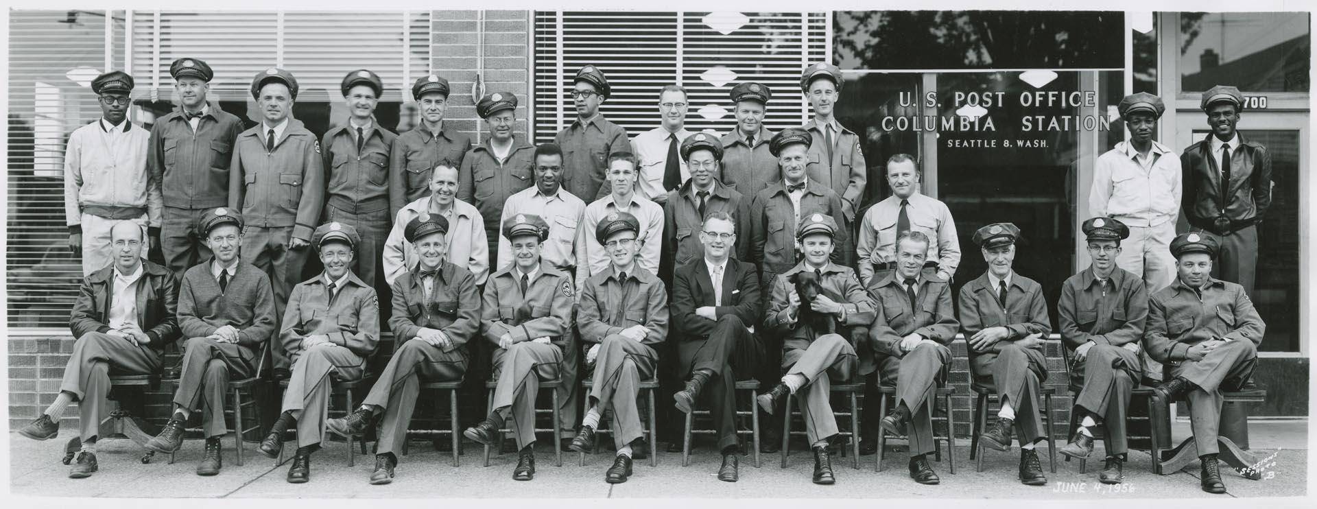 Image of U.S. Post office employees in front of Columbia Station, Seattle, June 4, 1956