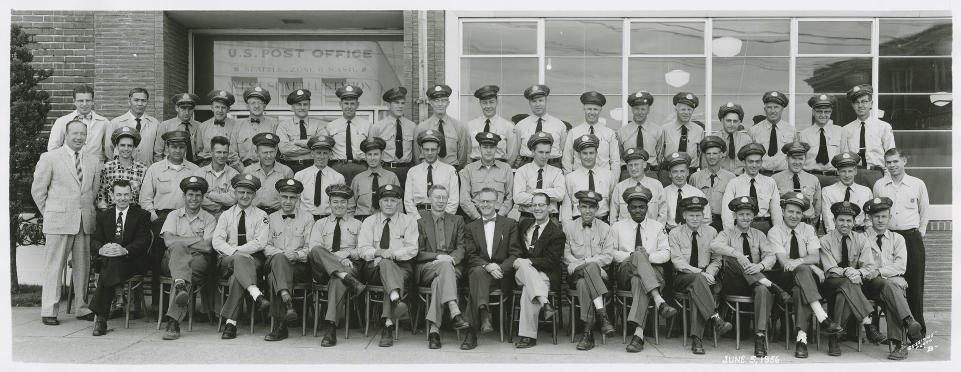 Image of U.S. Post office employees in front of West Seattle Station, June 5, 1956