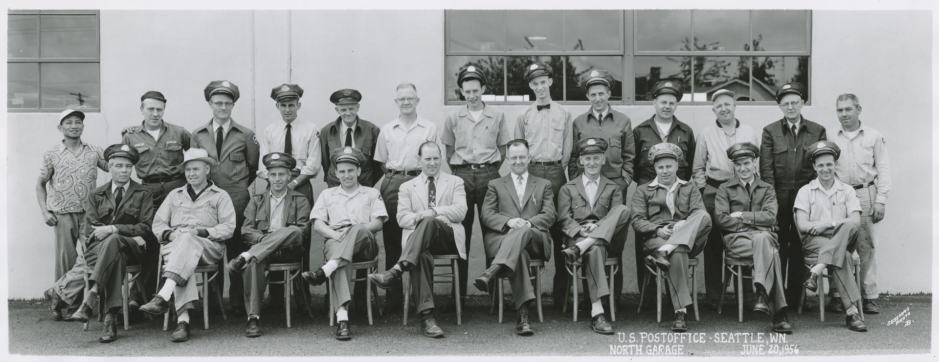Image of U.S. Post office employees in front of North Garage, Seattle, June 1956