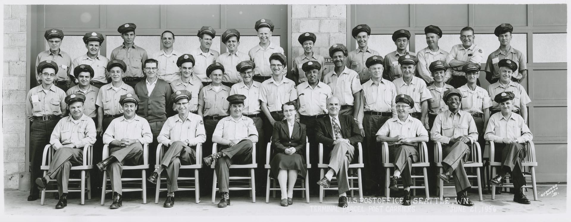 Image of U.S. Post office employees in front of Terminal Parcel Post Carriers, Seattle, June 1956