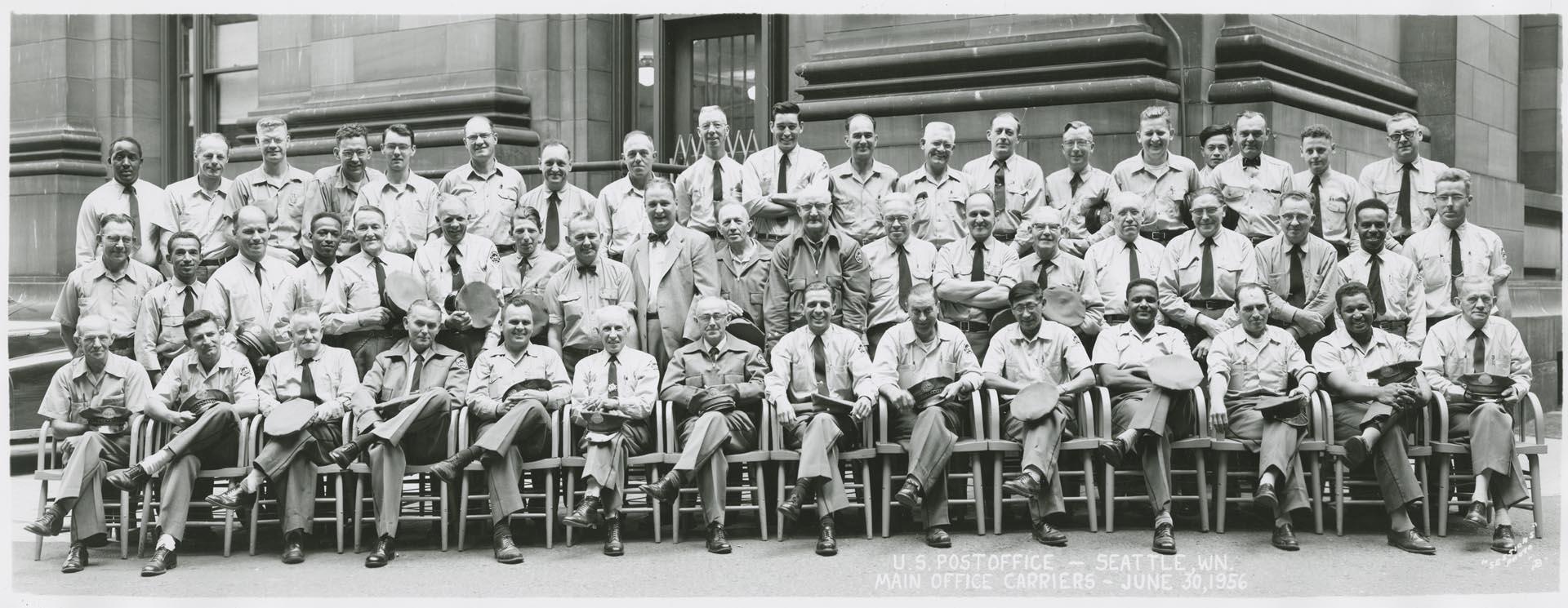 Image of U.S. Post office employees in front of Main Office Carriers, Seattle, June 1956