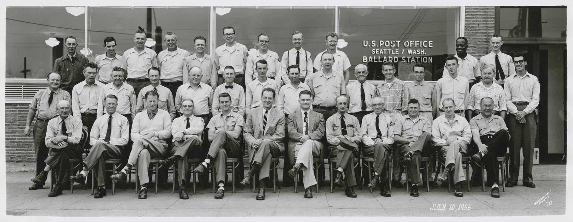 Image of U.S. Post office employees in front of Ballard Station, Seattle, June 1956