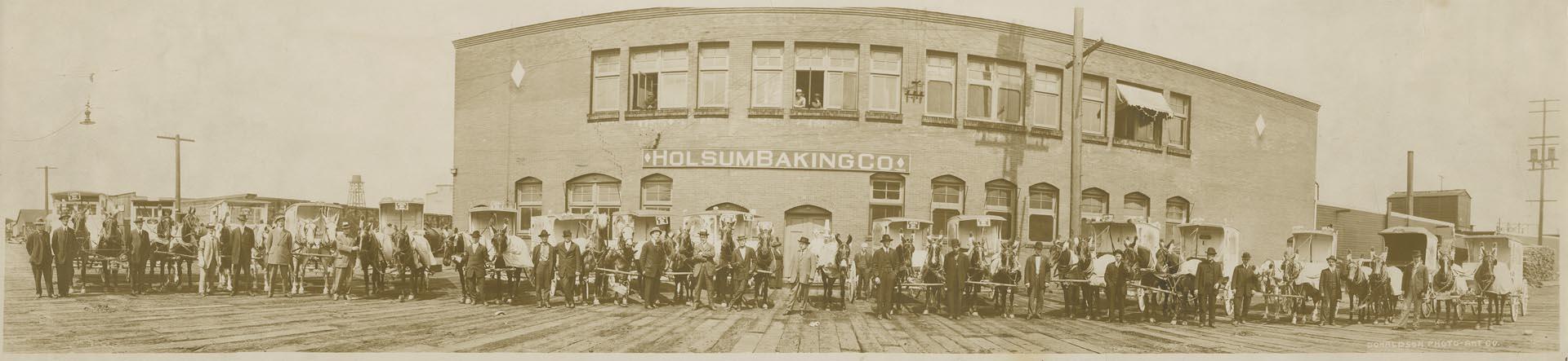 Image of Holsum Baking Co. employees pose in front of factory, Seattle, circa 1914