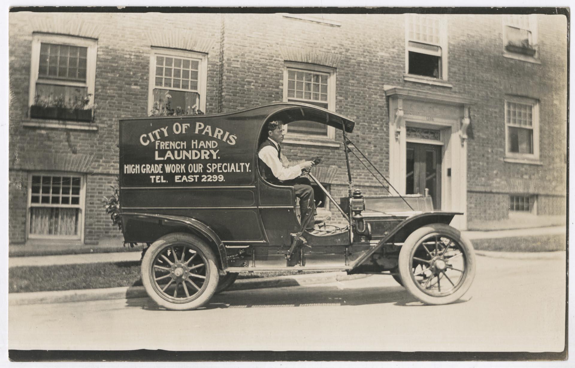 Image of Laundry delivery car and driver, Seattle, circa 1914