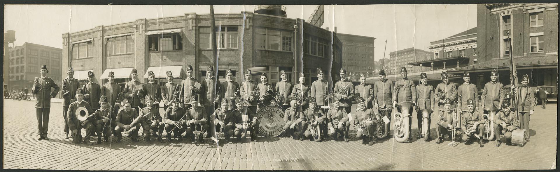 Image of Nile Temple Band in front of King Street Station, Seattle, June 3, 1919