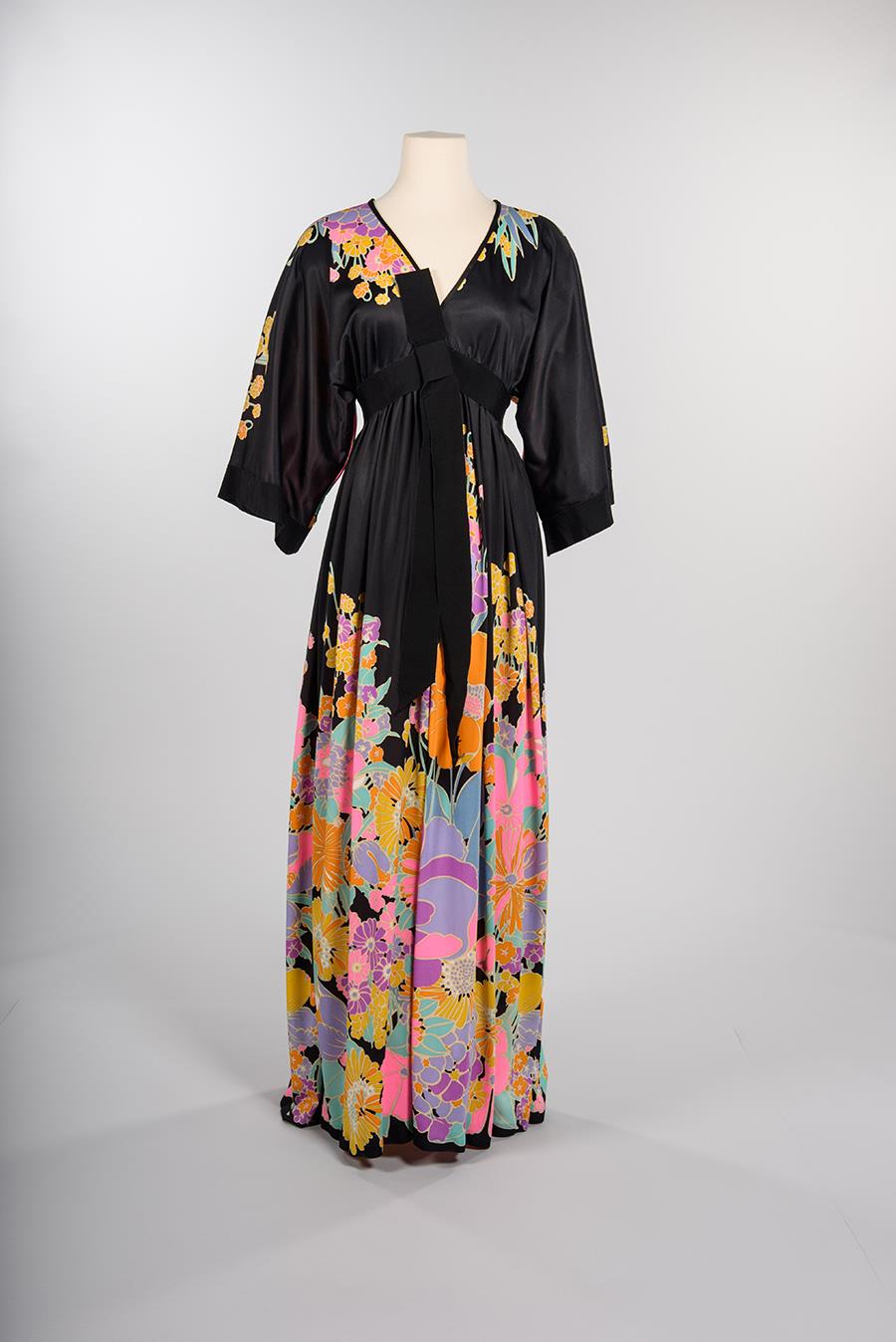 Image of Black dress with bright floral pattern designed by Richmond of Seattle, ca. 1970s-1980s