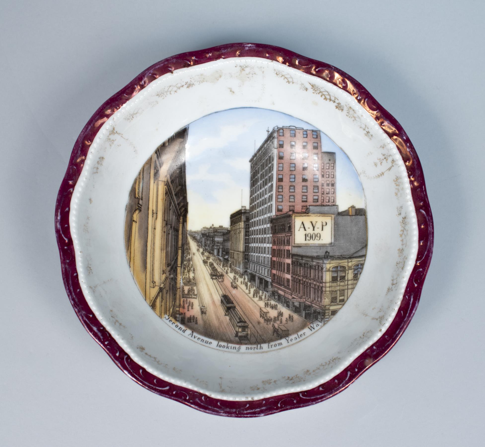 Image of Souvenir bowl from the Alaska-Yukon-Pacific Exposition (AYPE) in Seattle in 1909, and features an image of Second Ave in downtown Seattle
