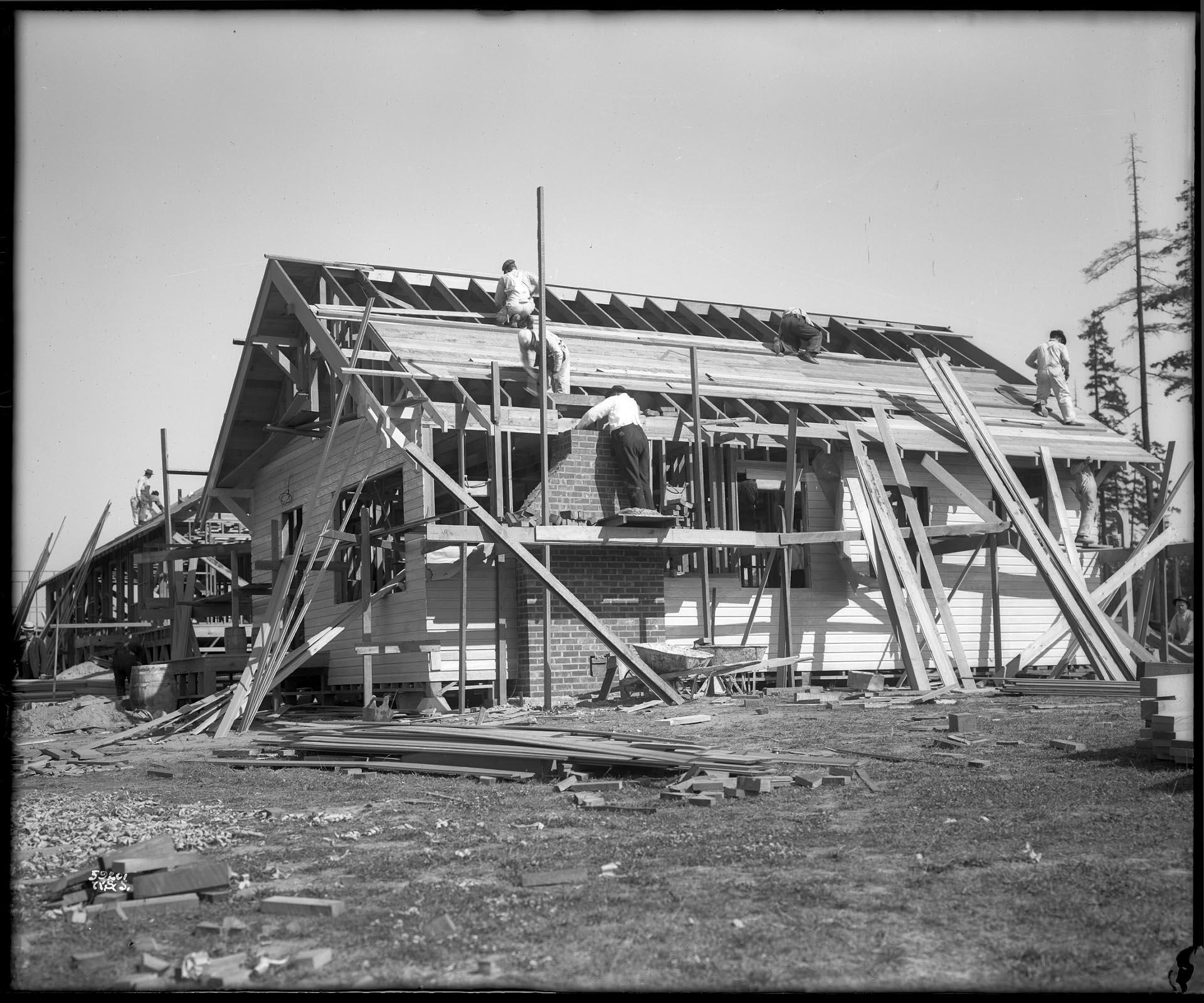 Image of Men constructing buildings for military on University of Washington campus, Seattle, 1917