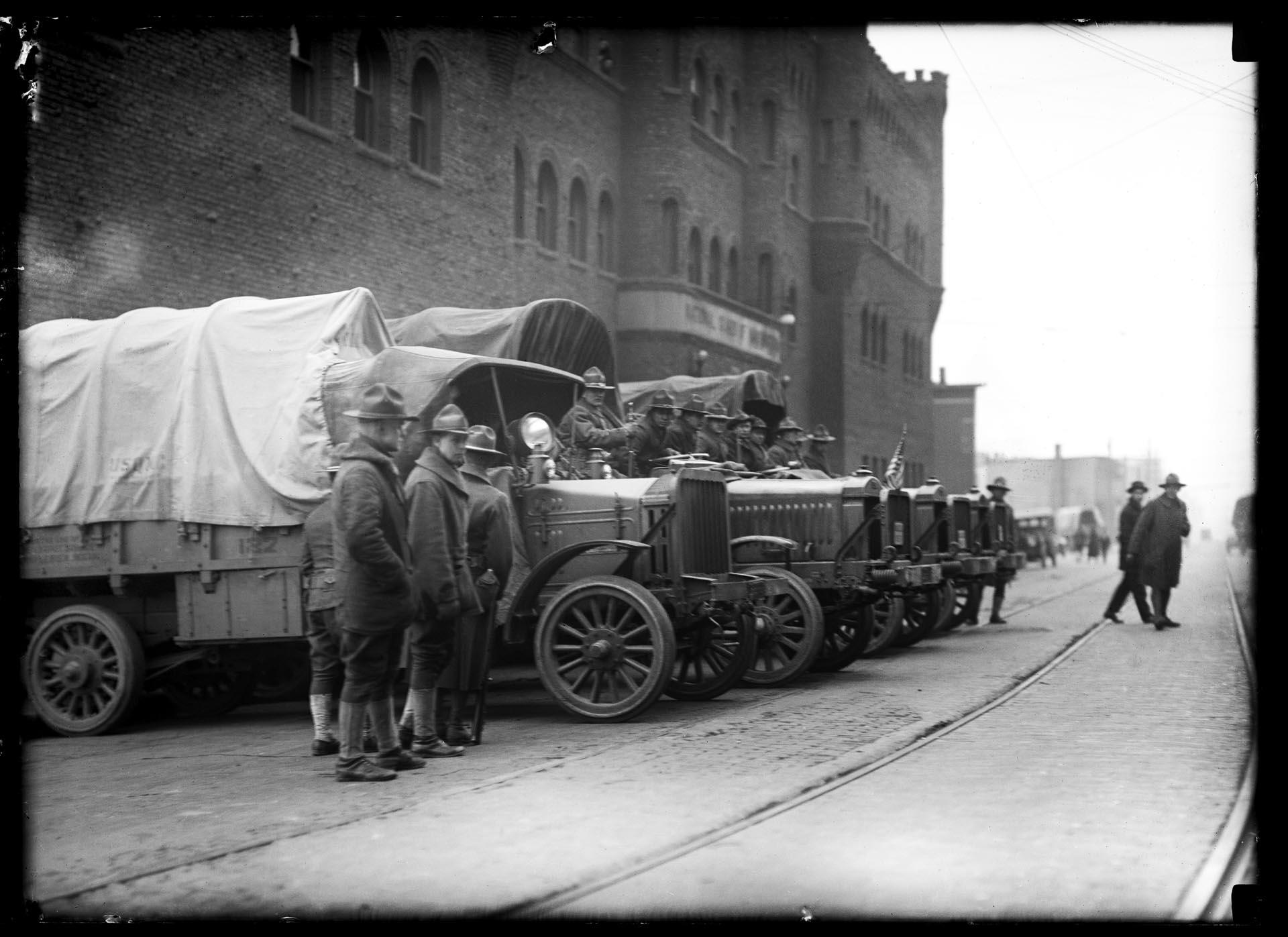 Image of Soldiers and trucks outside National Guard Armory, Seattle, February 1919