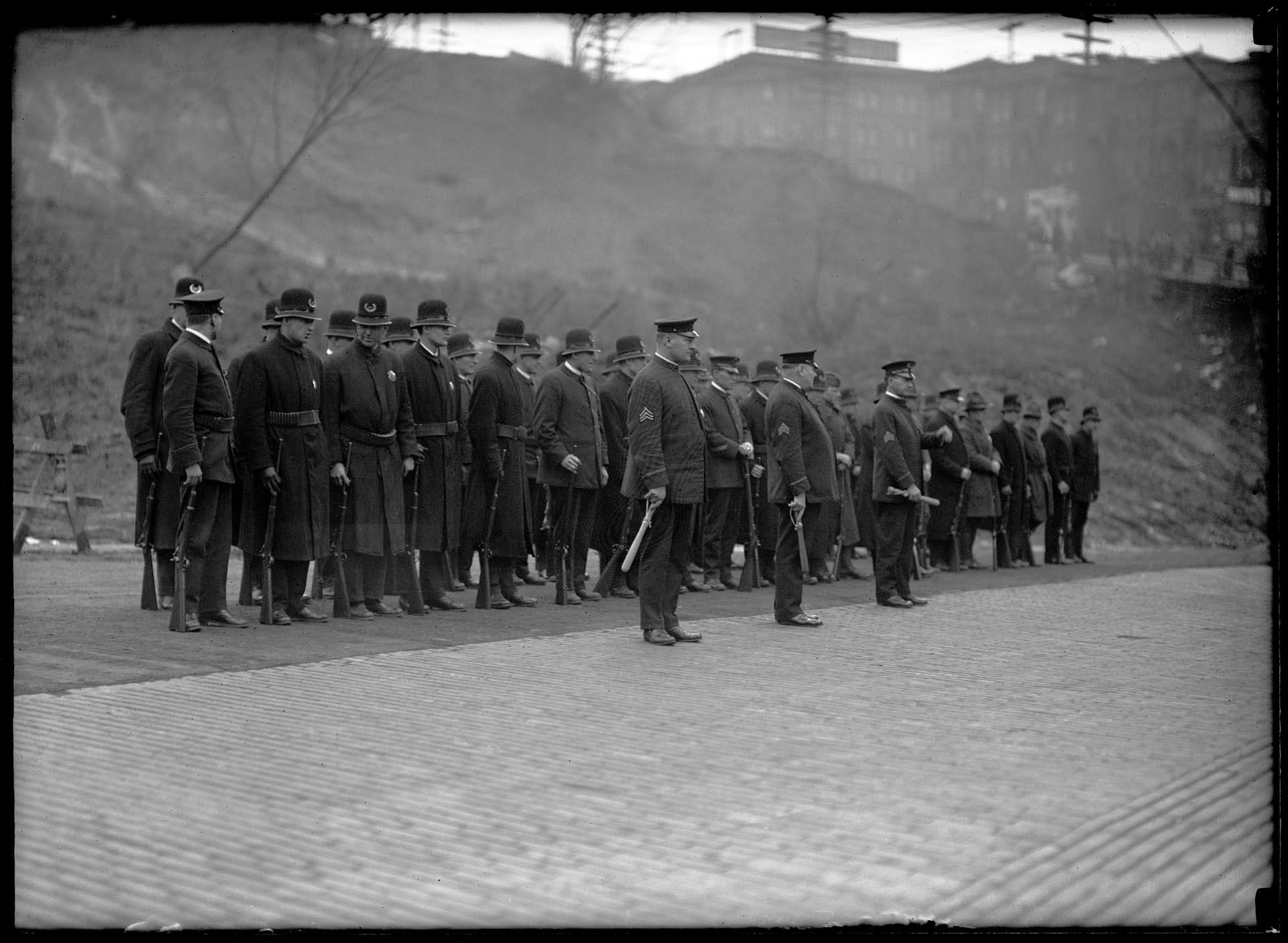 Image of Police officers standing on cobbled street during Seattle General Strike,  February 1919