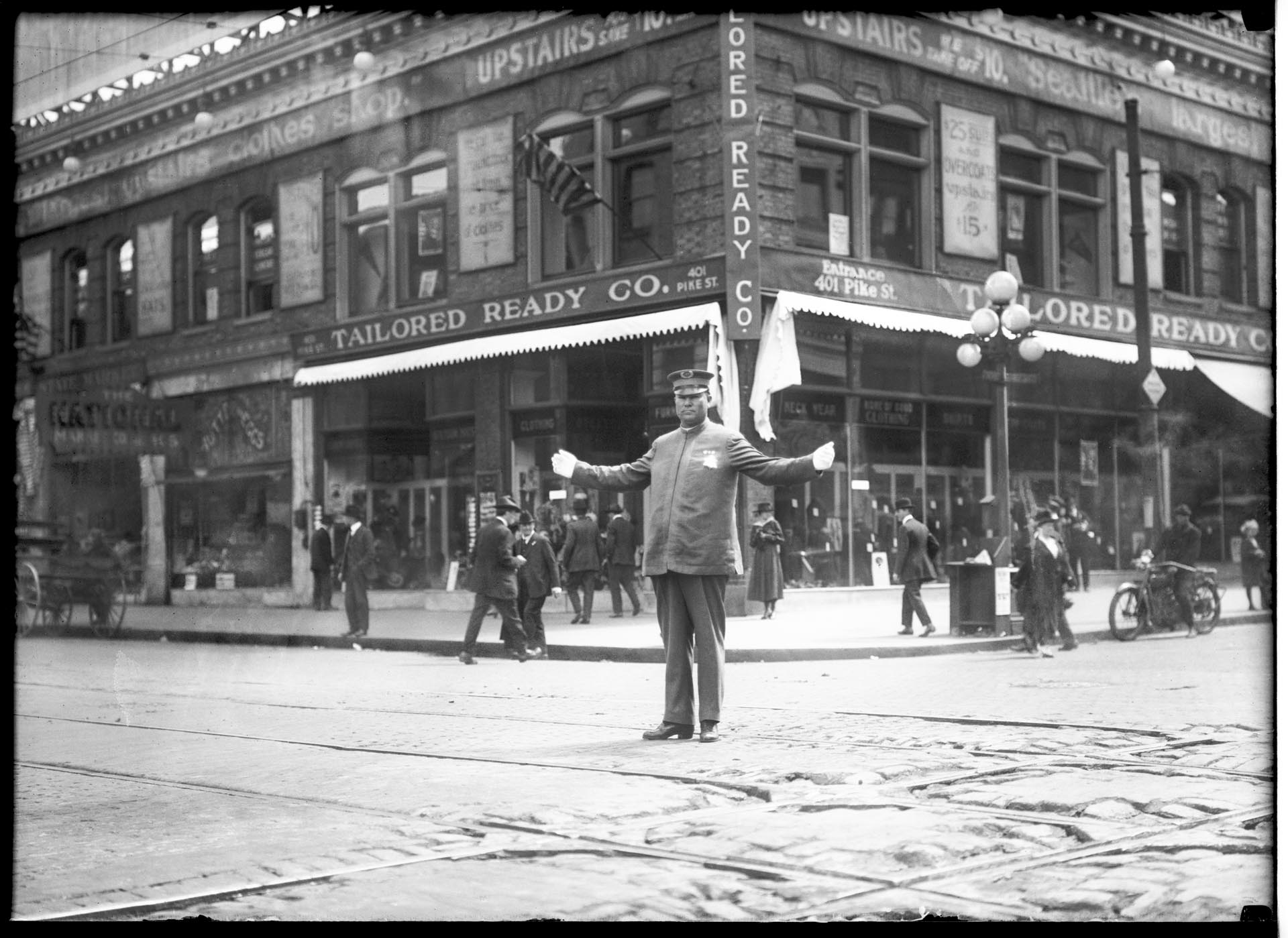 Image of Police officer directing traffic at 4th and Pike, Seattle, circa 1920