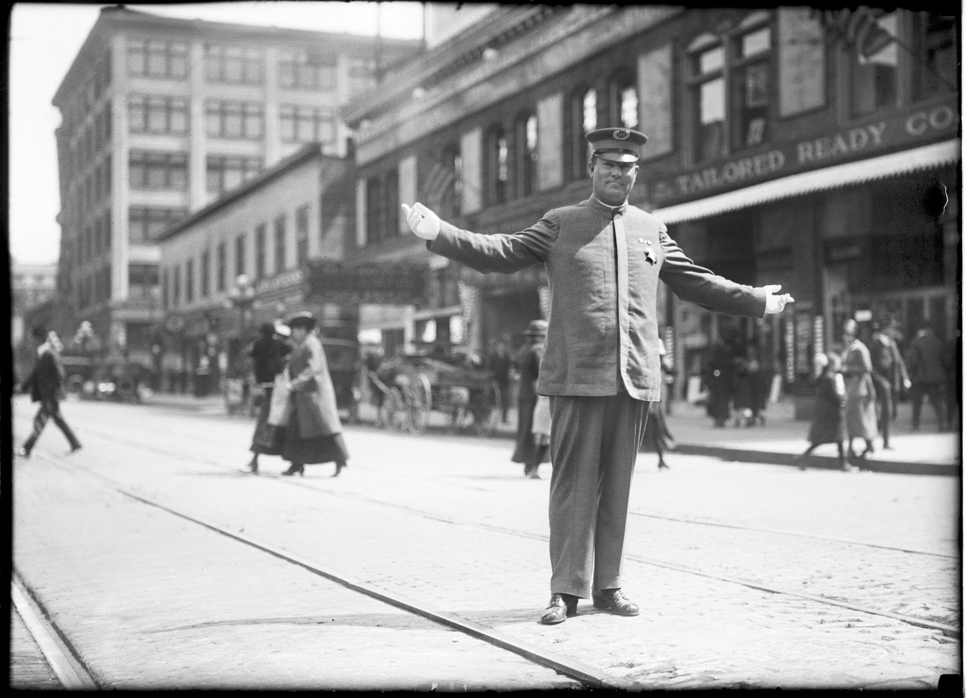 Image of Police officer directing traffic at 4th and Pike, Seattle, circa 1920