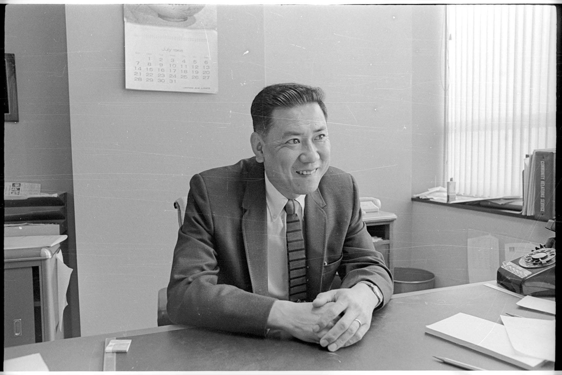 Image of Philip Hayasaka sitting at desk, Seattle, August 30, 1968